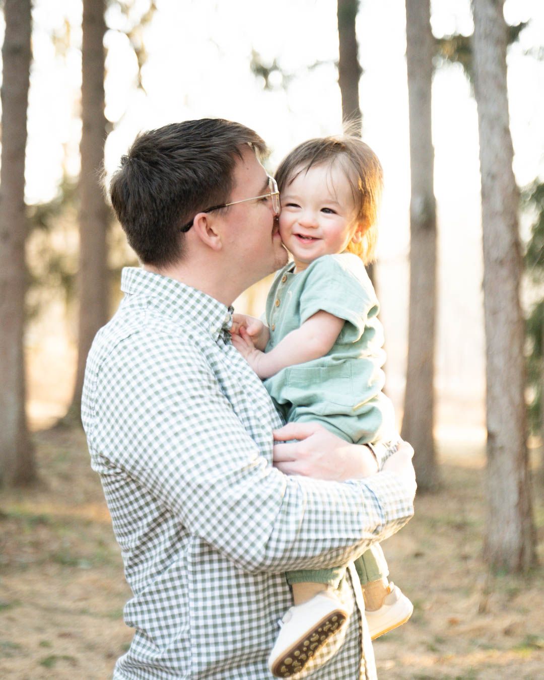 Father kissing toddler's cheek