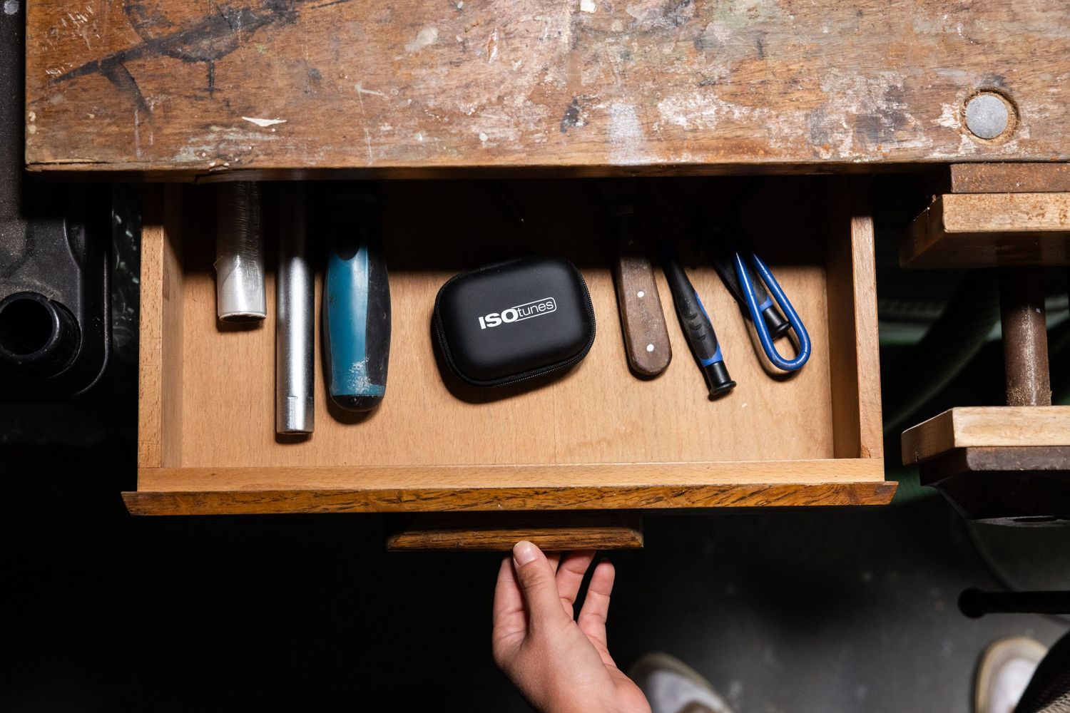 Overhead view of workbench with electronic tools and equipment laid out.