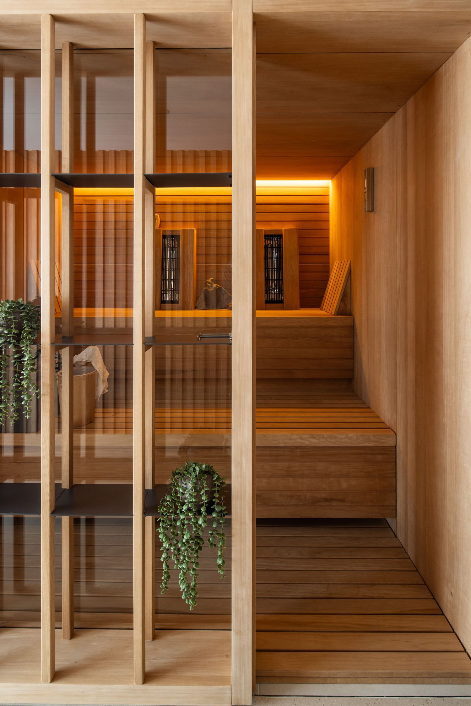 Wooden sauna or spa interior with tiered benches and ambient lighting.