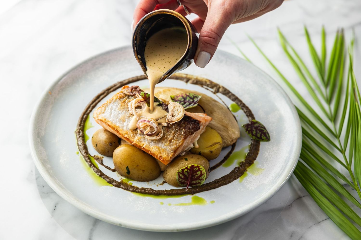 Professional food photography sequence showing various gourmet dishes being plated and garnished.