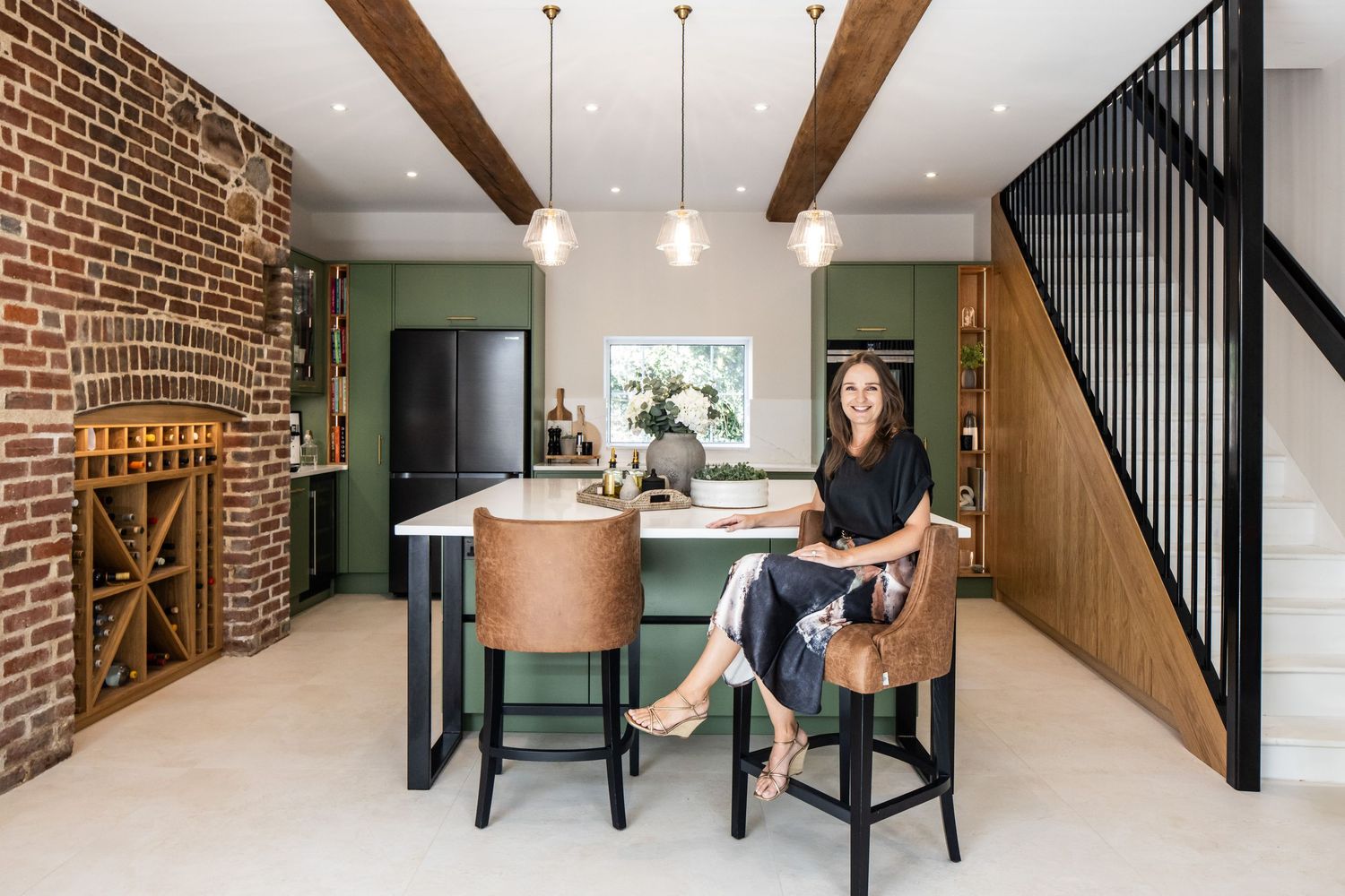 Industrial-style dining area with exposed brick walls and wooden beam accents.