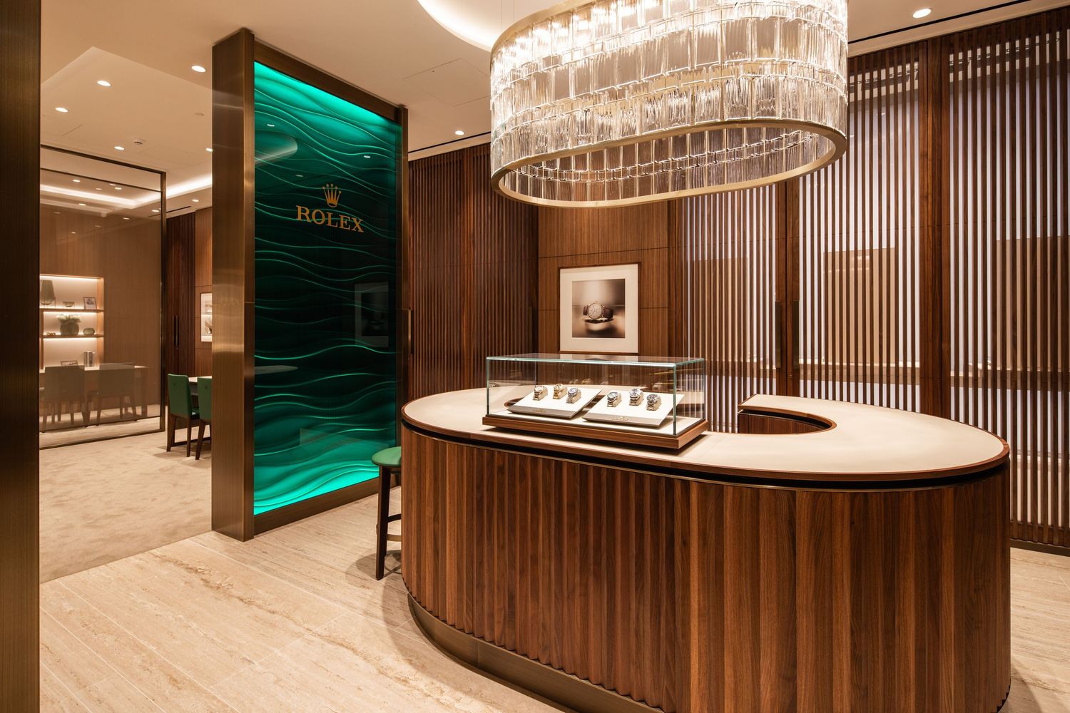 Luxurious retail interior featuring wood paneling, crystal chandeliers, and high-end display cases.