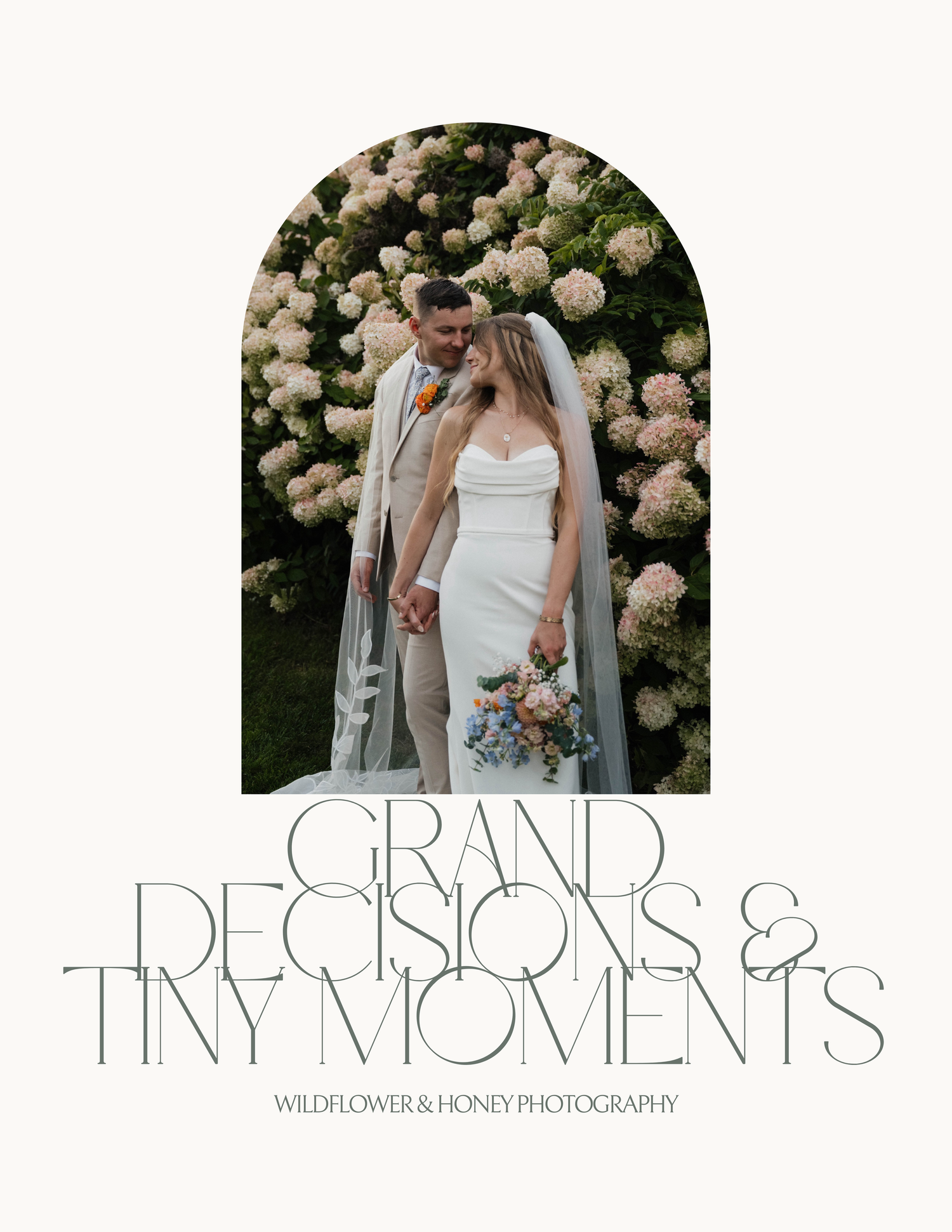 Bride and groom kissing in front of blooming white hydrangea garden wall in elegant wedding portrait.