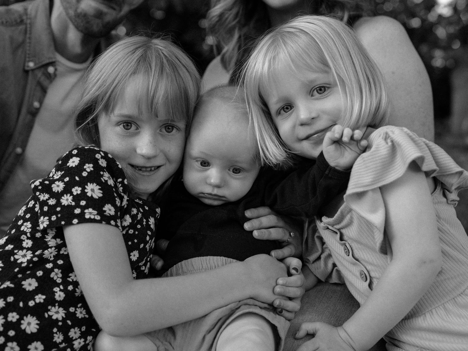 Black and white portraits showing tender moments between people.