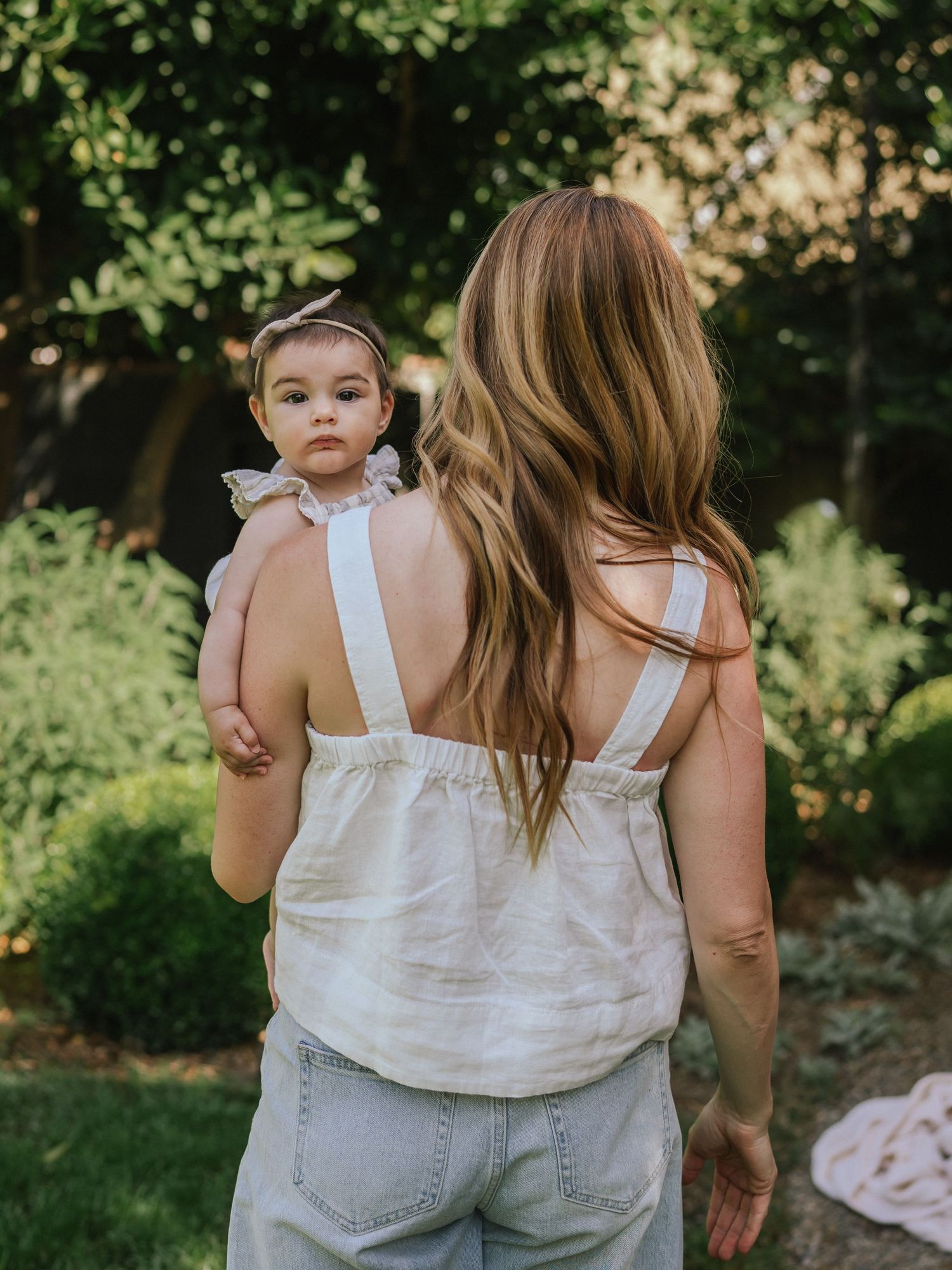 A series of candid outdoor moments captured in a lush garden setting.