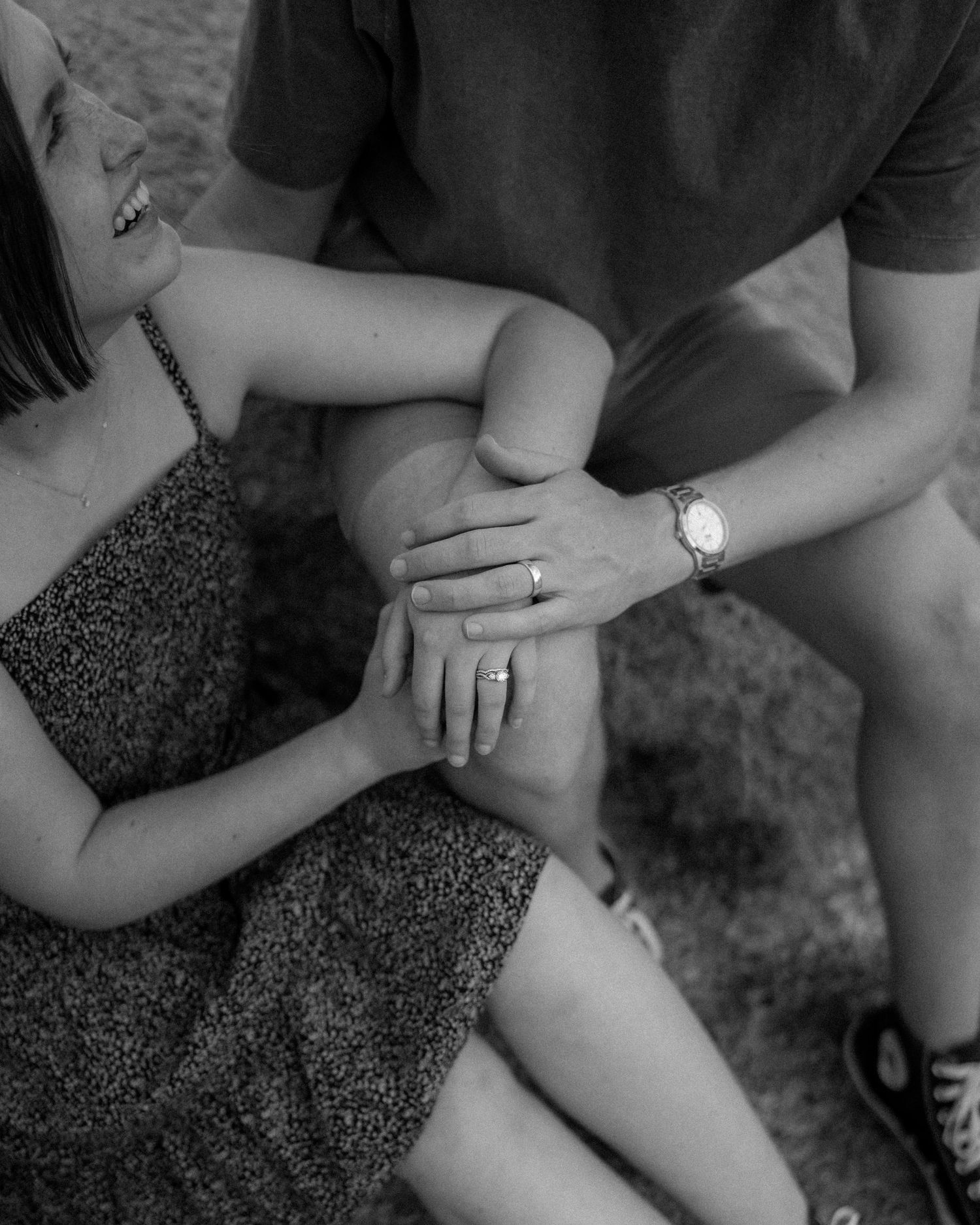 Black and white detail shots focusing on hands and intimate gestures.