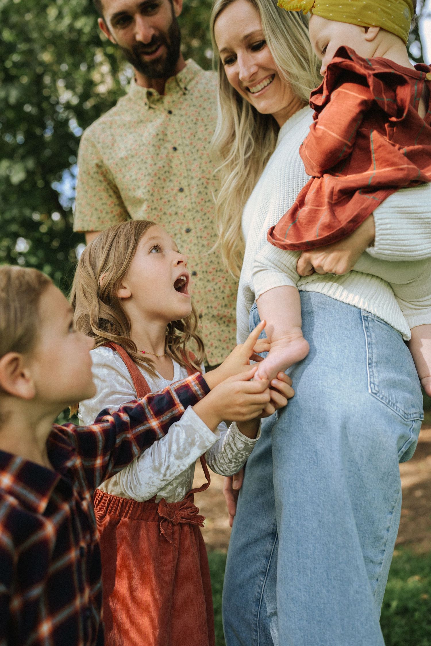 A playful sequence of outdoor family moments captured in autumn with casual clothing and warm tones.