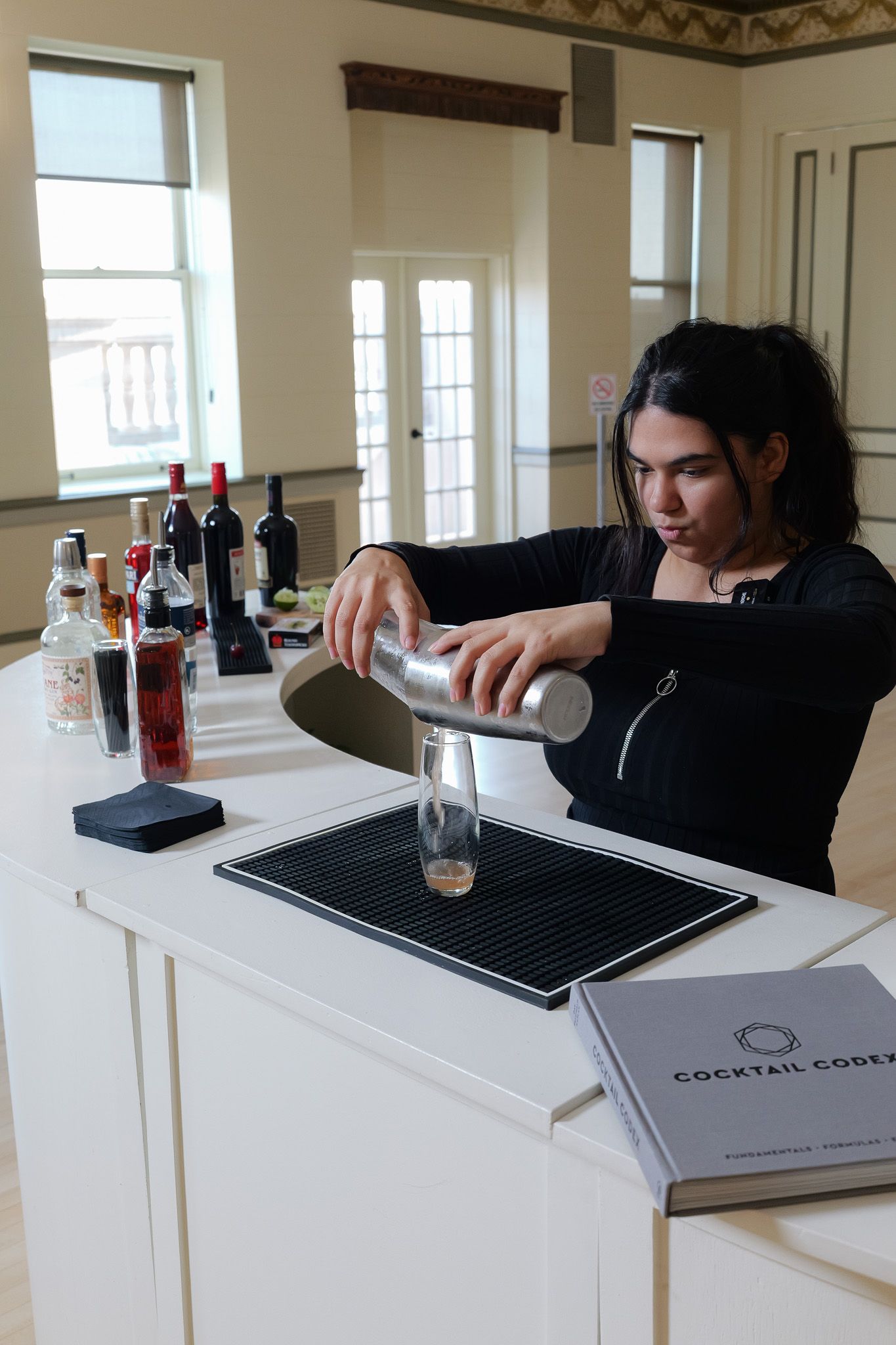 bartender pouring custom cocktails at Fresno reception