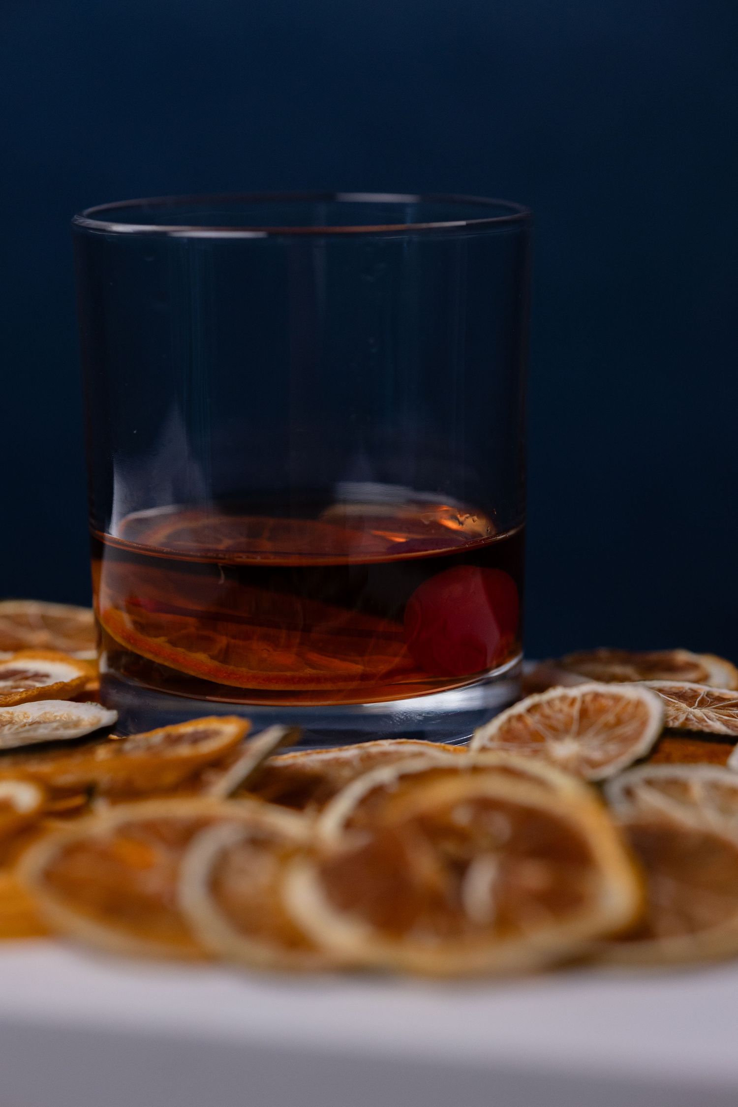 elevated bar cocktail with hand dried ingredients