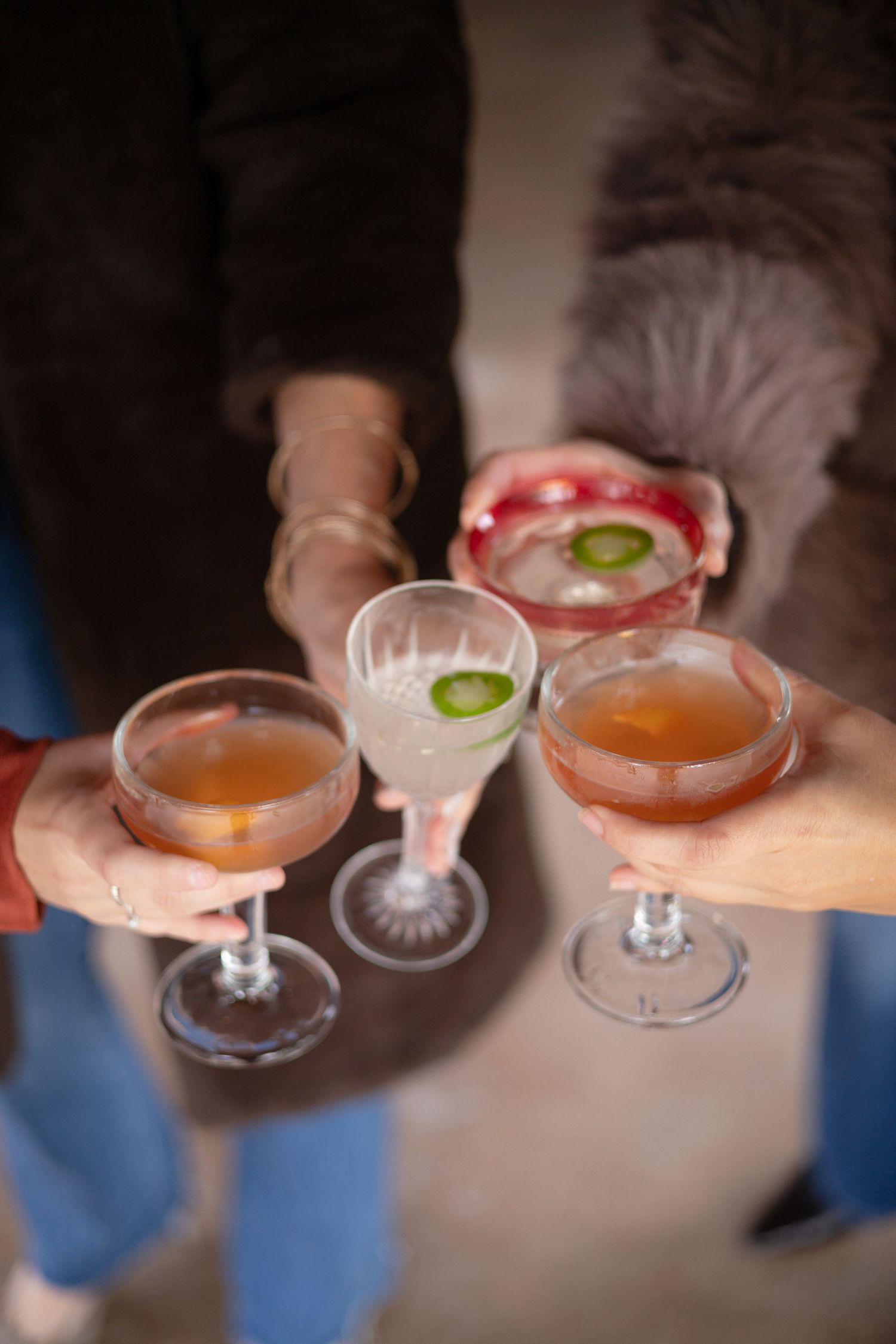 friends toasting drinks at wedding reception