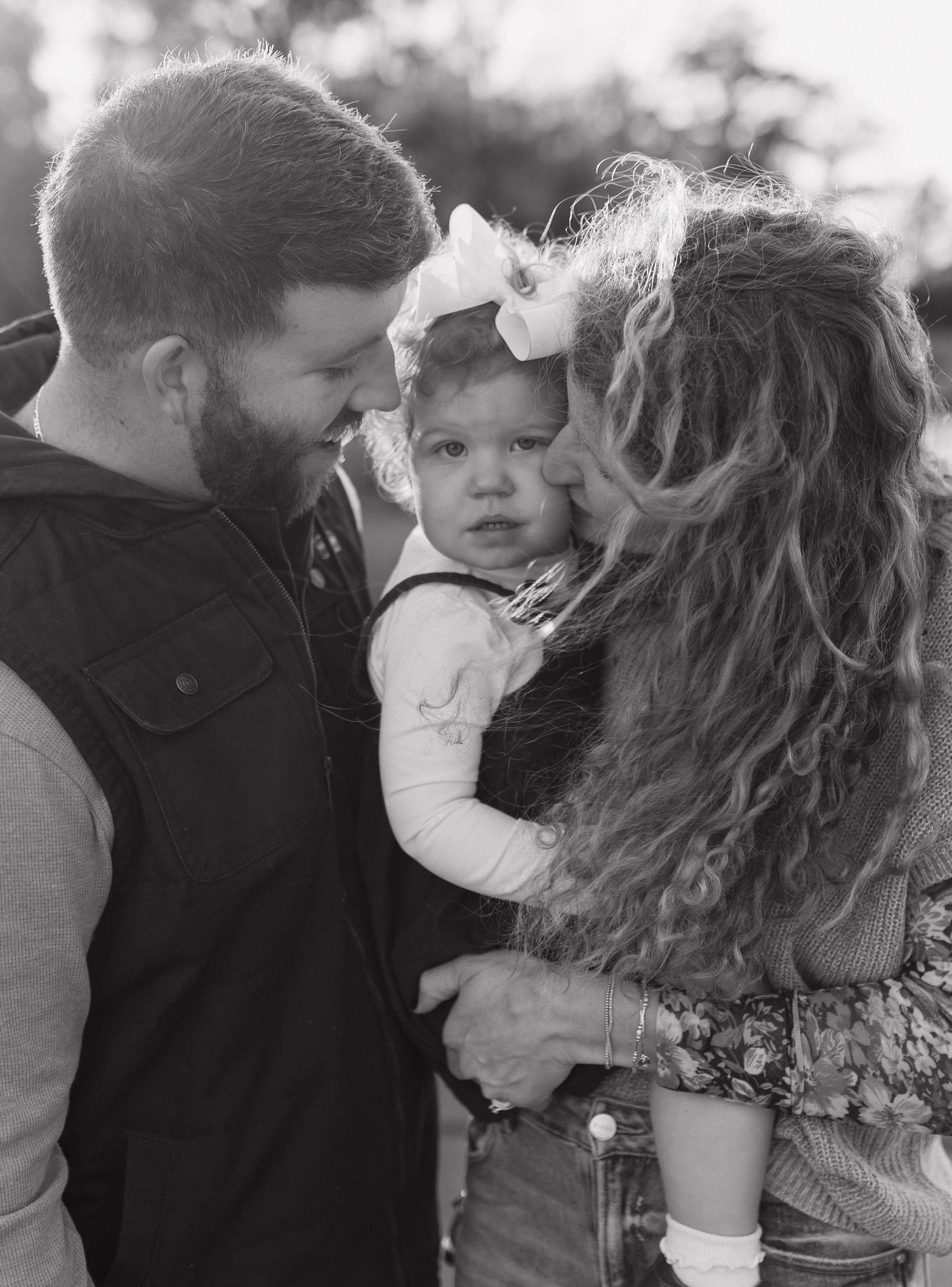 Family portrait session with baby in black and white outdoor setting. Alabama photographer; South Alabama photographer