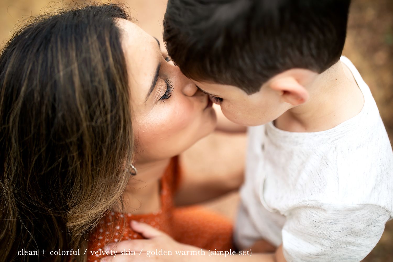 An intimate close-up moment captured between two people in warm lighting.