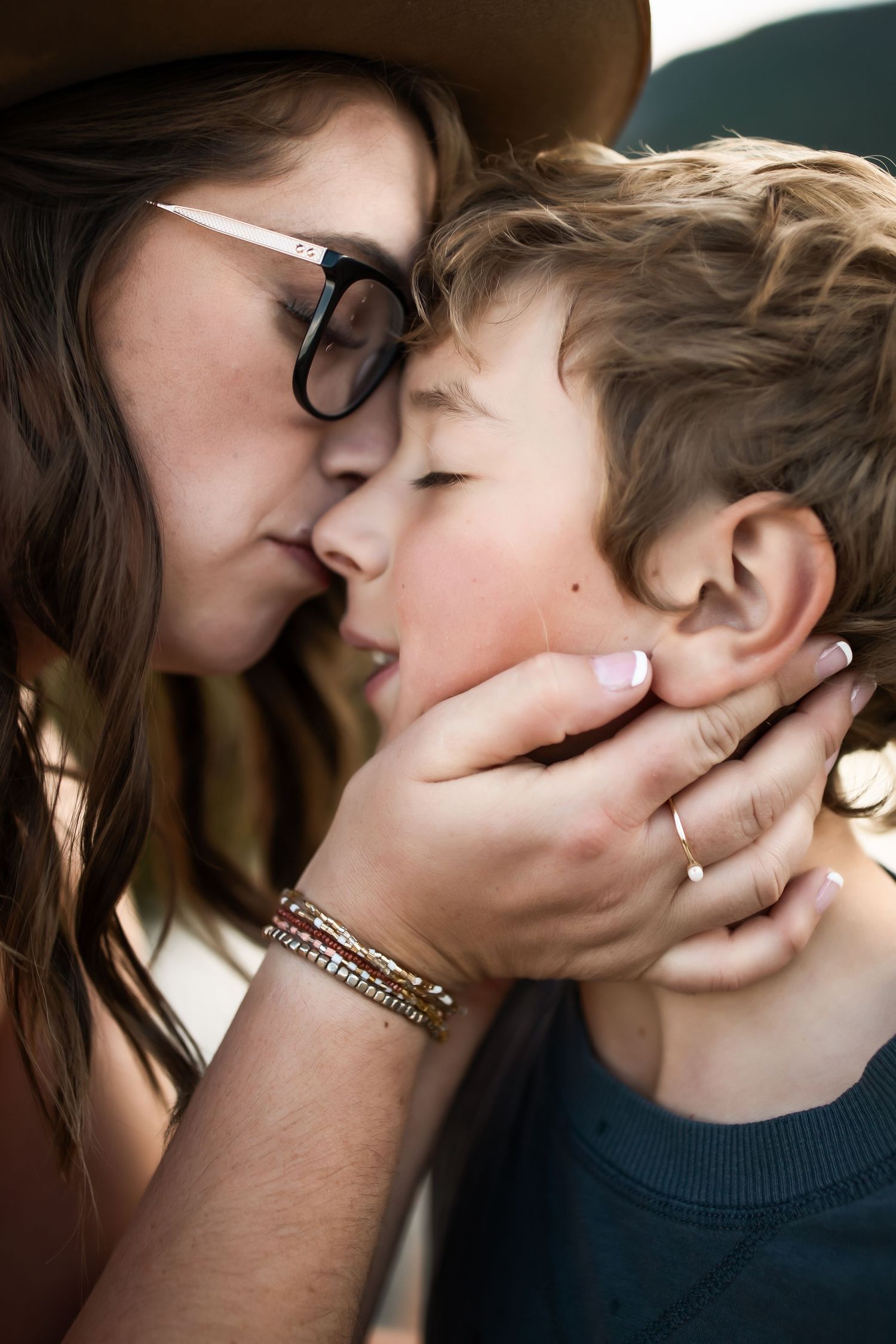 A series of intimate close-up photos showing a couple sharing tender kisses and romantic moments together.