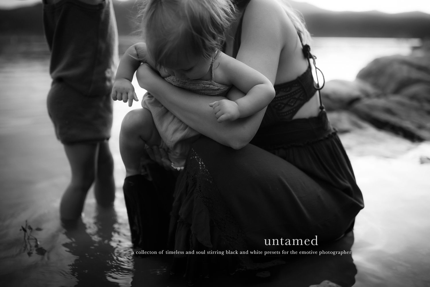 Intimate black and white photo series capturing tender moments between people outdoors.
