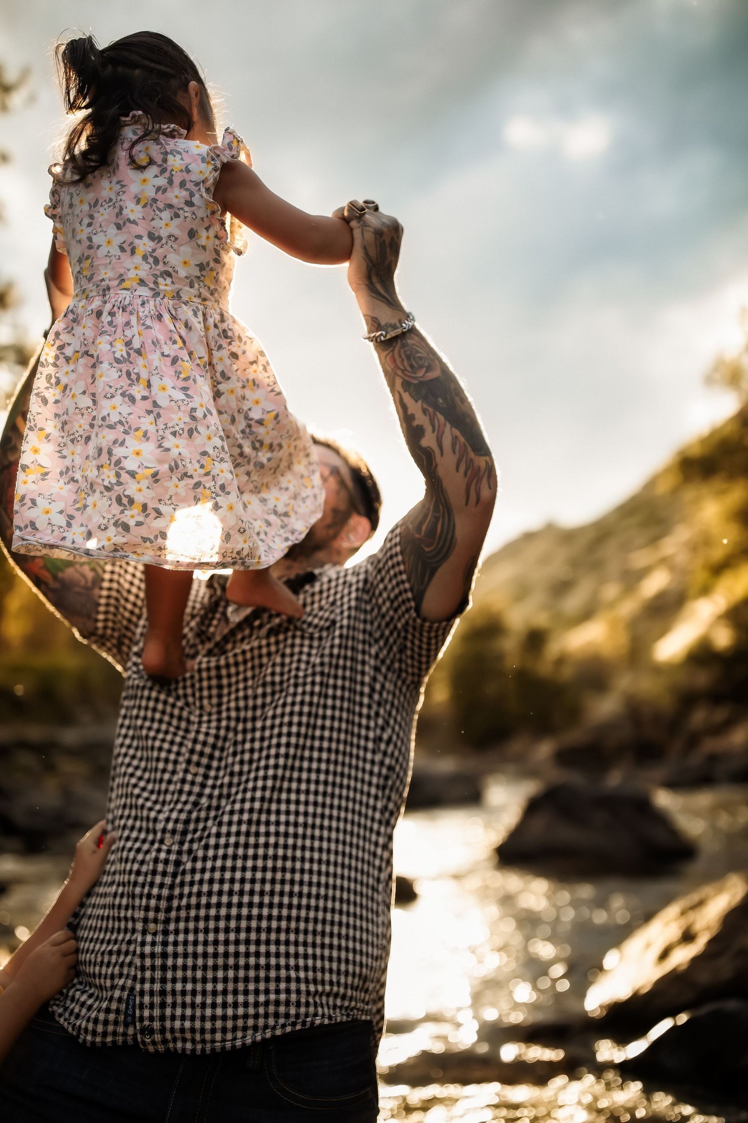 A series of sunset beach photos showing a floral dress and checkered shirt against golden light and rocky coastline.