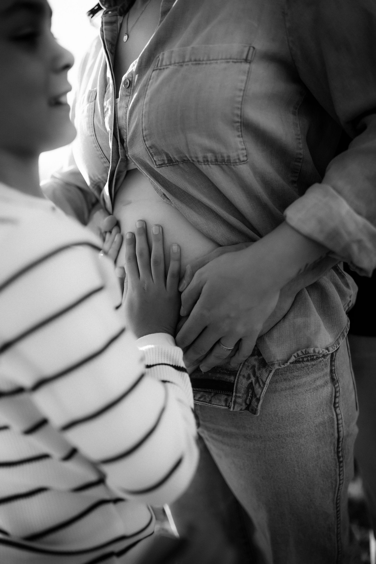 Black and white close-up series showing gentle hand gestures and intimate moments.