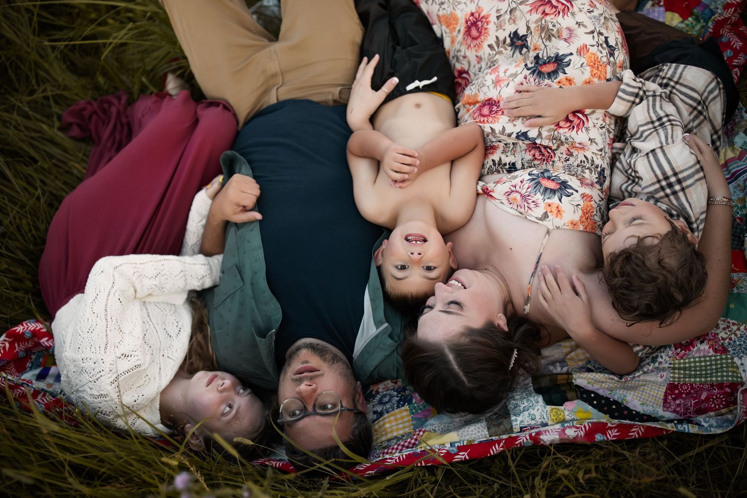 Family portrait showing connection and joy in natural outdoor setting.