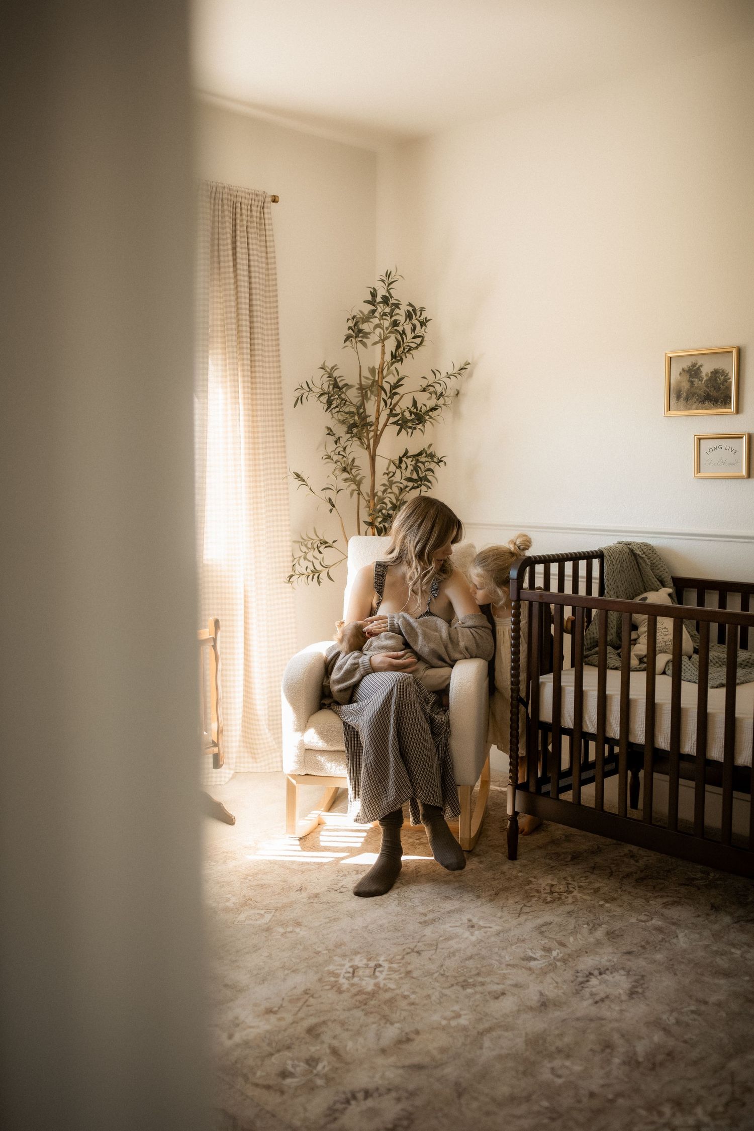 A series of emotional photos showing a person sitting in a nursery room with a dark wooden crib and sunlit window.