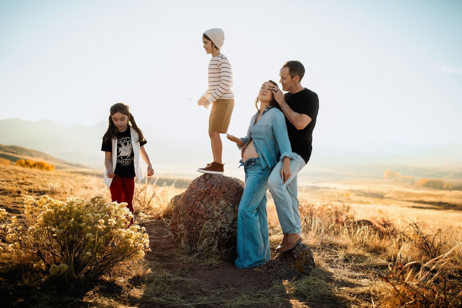 Casual outdoor photography session in rolling hills during late afternoon light.