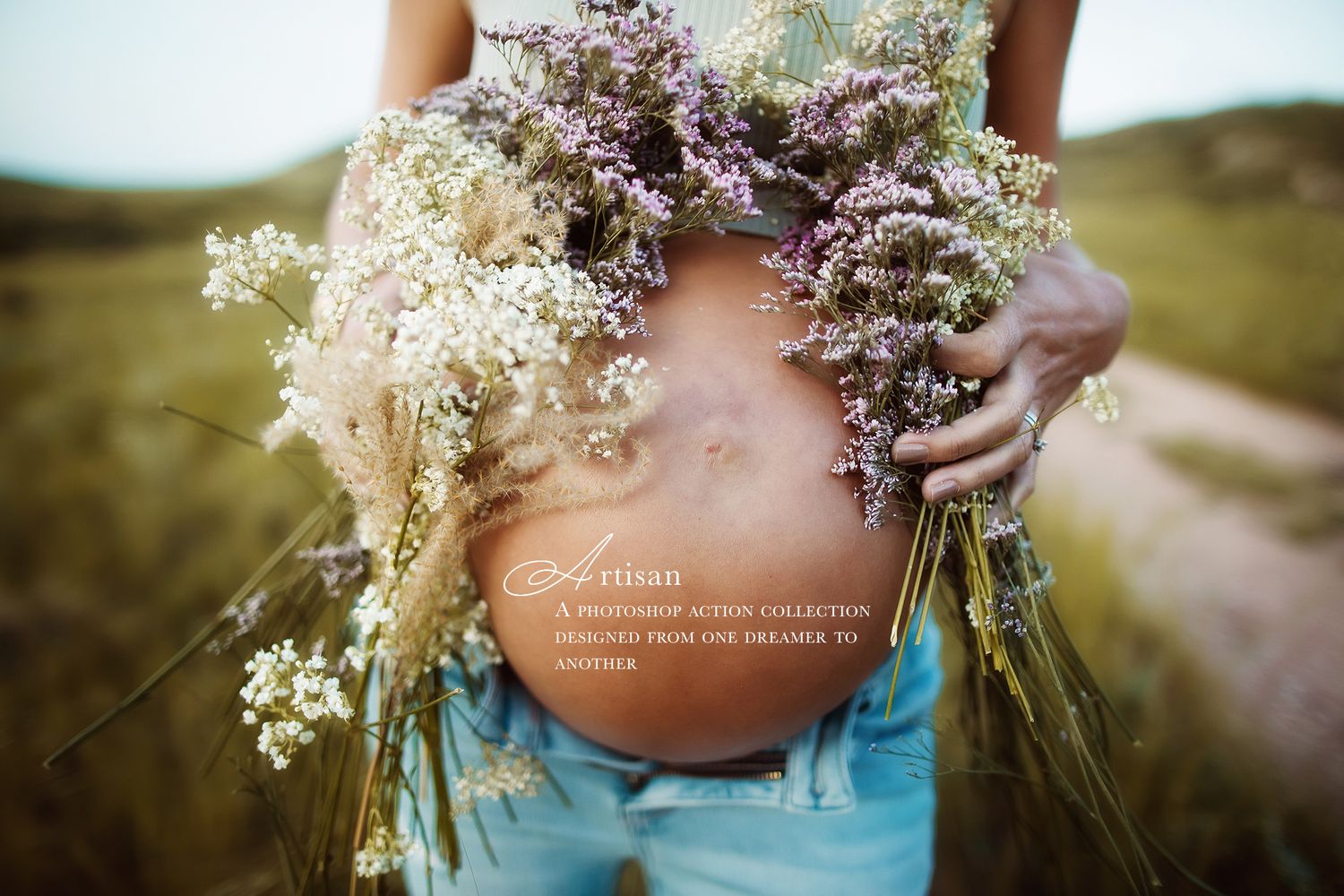 Close-up of delicate dried flowers and baby's breath bouquet against blue fabric.