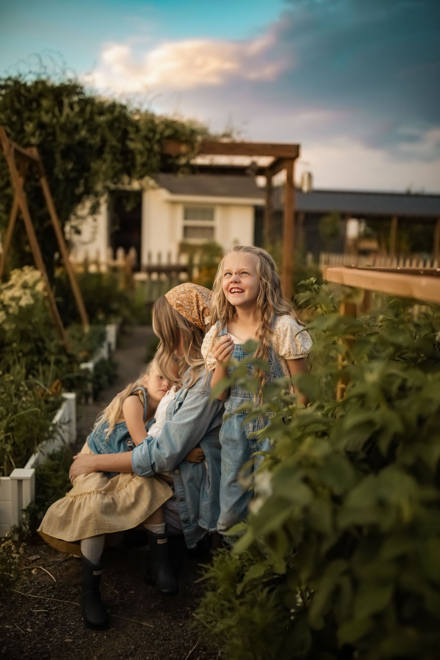A sunset photoshoot in a garden setting with natural lighting and greenery in the background.