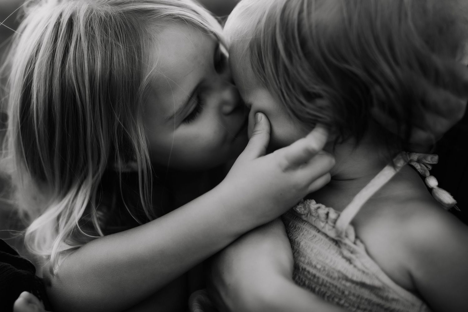 Black and white intimate close-up portraits showing emotional connection.