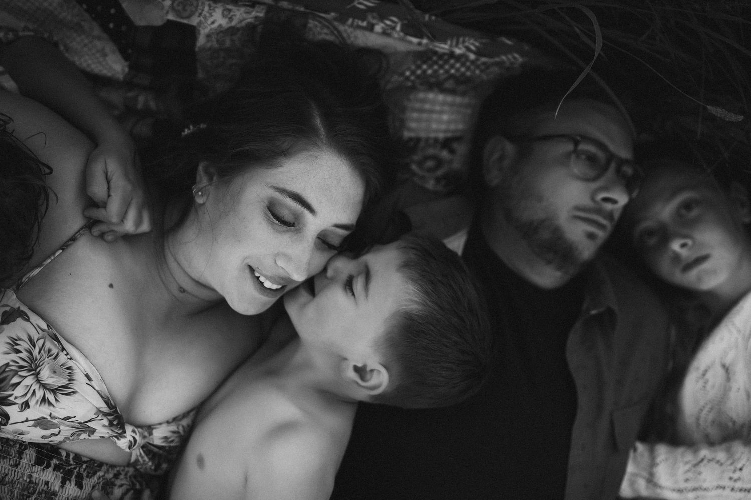 Artistic black and white portraits capturing intimate moments between a couple.