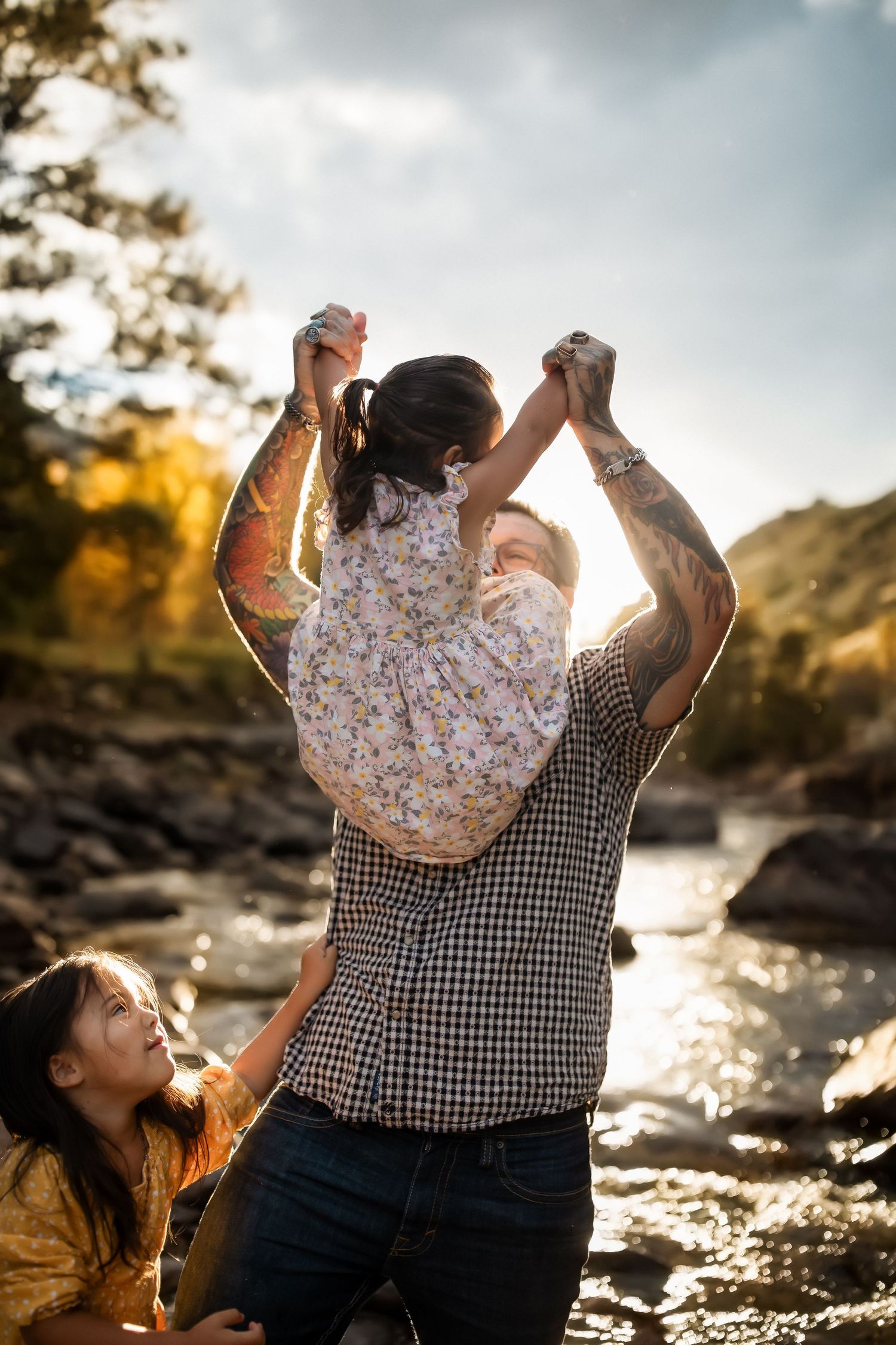 Candid photos capturing playful moments between two people by a waterfront at golden hour.