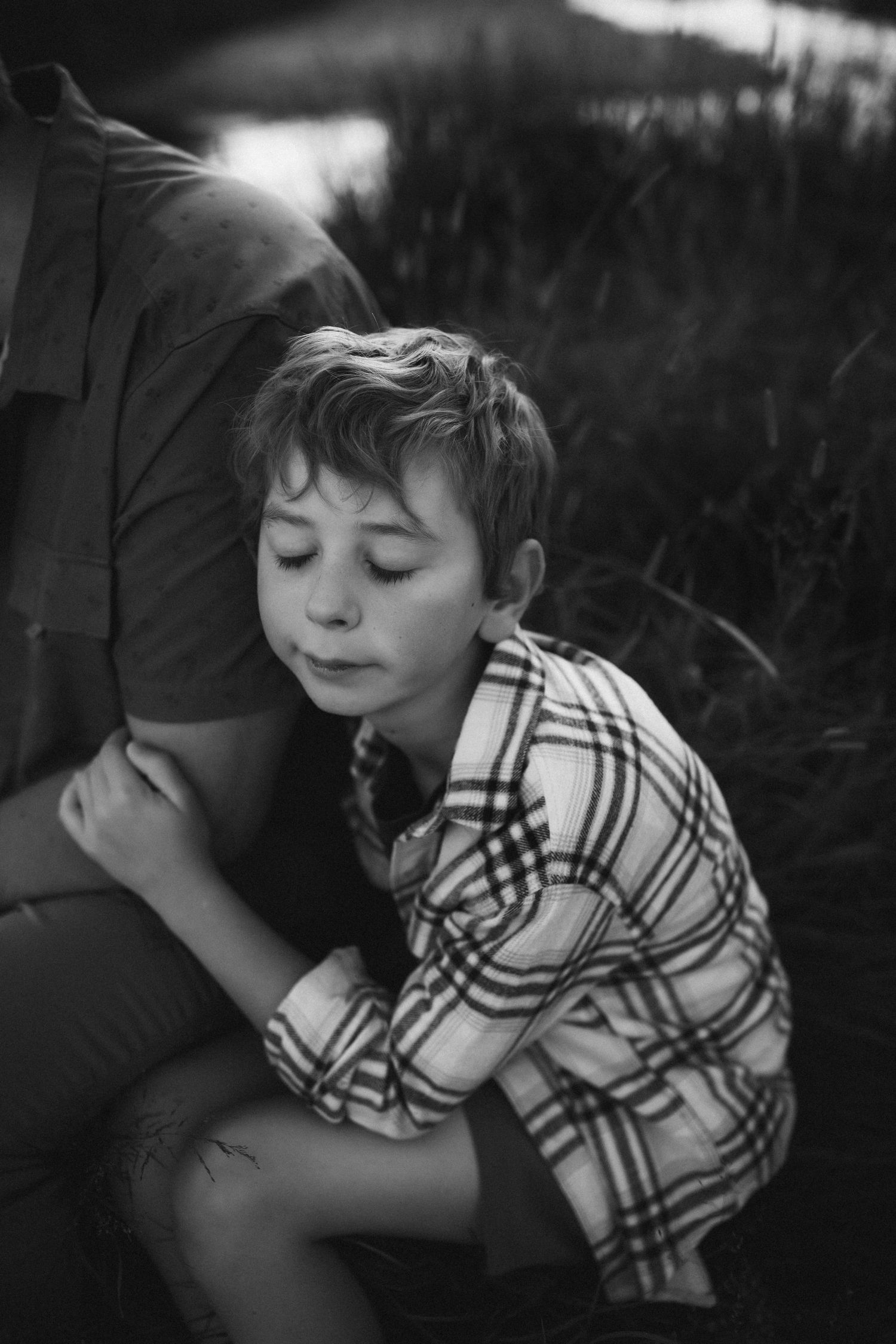 Intimate black and white portrait showing connection and emotion.