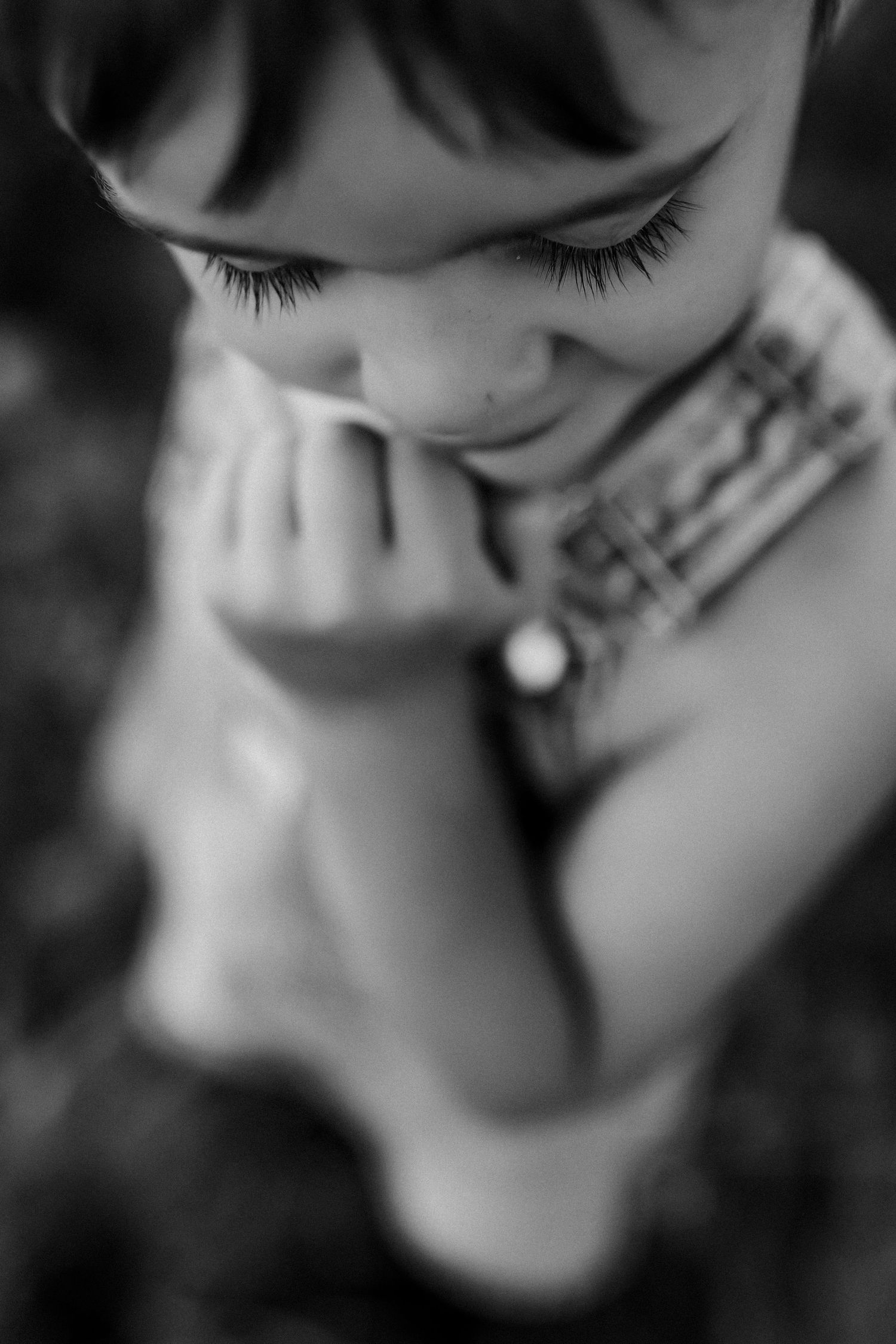 Artistic black and white close-up portrait series showing eyelashes and facial features.