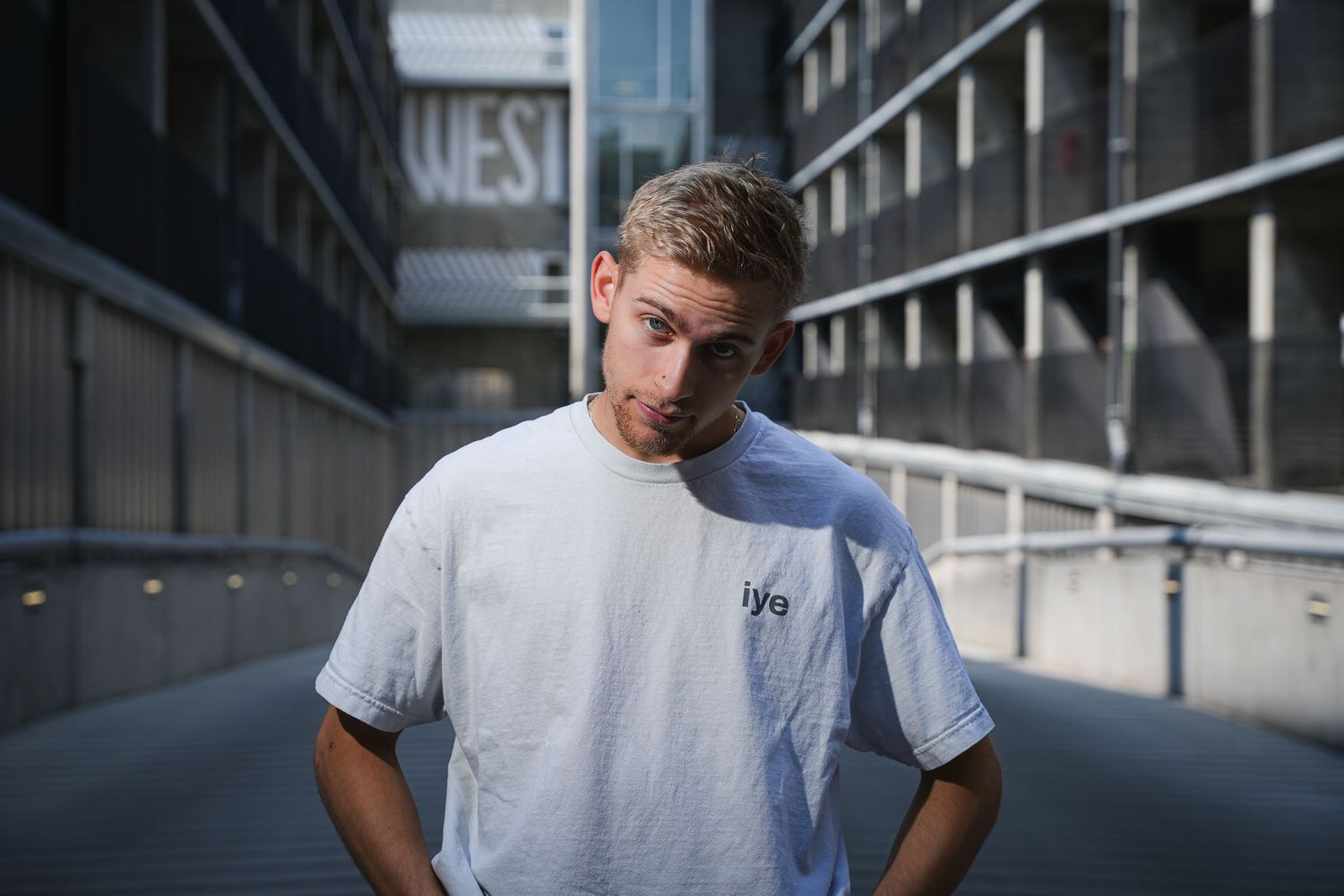 Athletic figure practices parkour moves against urban architecture backdrop.