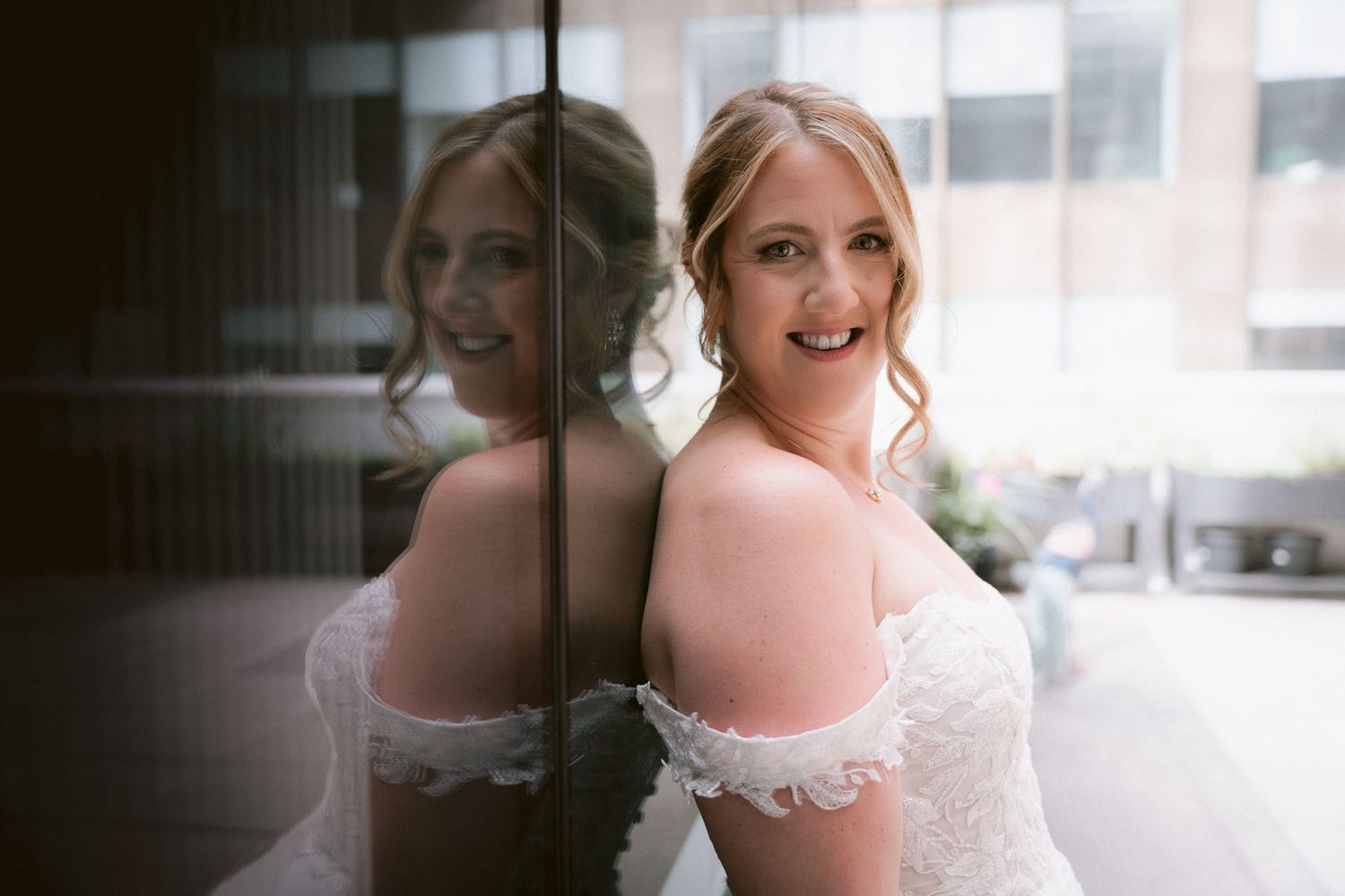 Joyful wedding party moments captured in natural light with bridesmaids in purple dresses.
