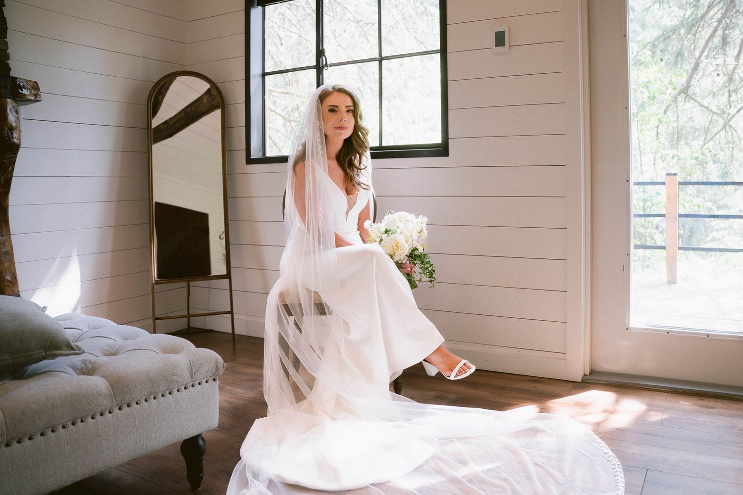 Bridal portraits in minimalist white room with natural window lighting in the Bridal Suite at The Valley Weddings