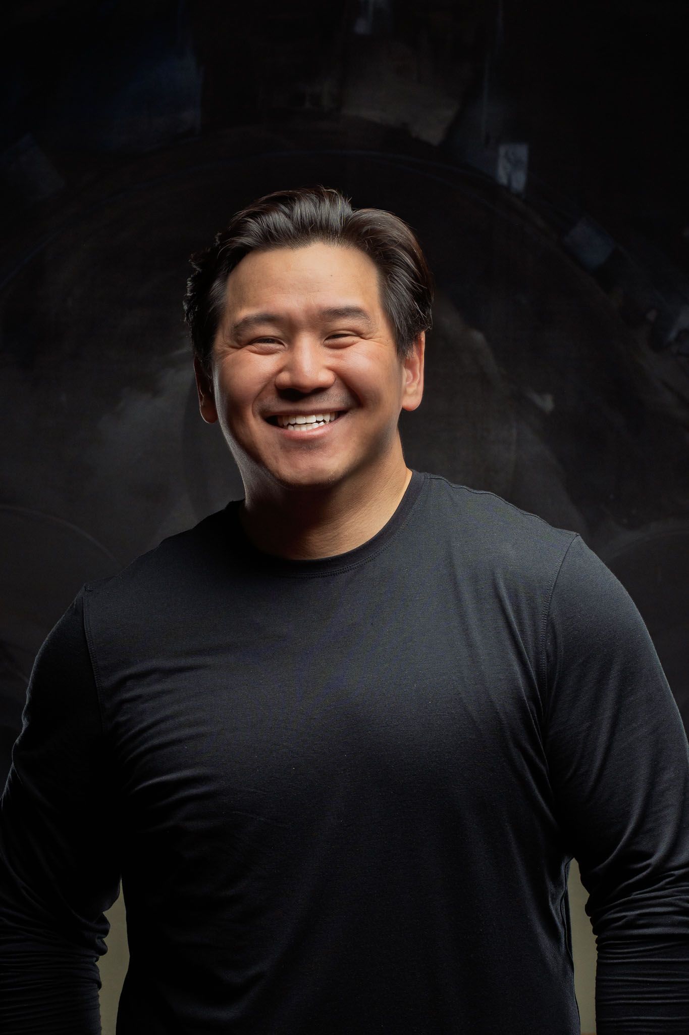 Series of headshots against dark background showing warm expressions in black long sleeve shirt.