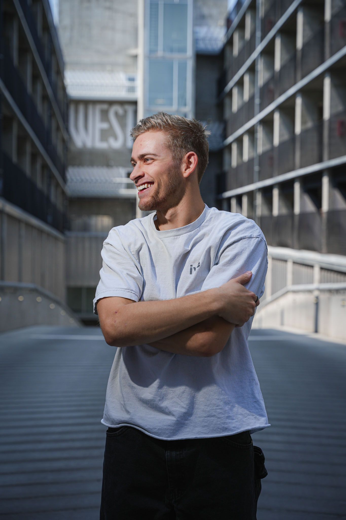 Expressive portrait series showing joyful emotions against urban setting.