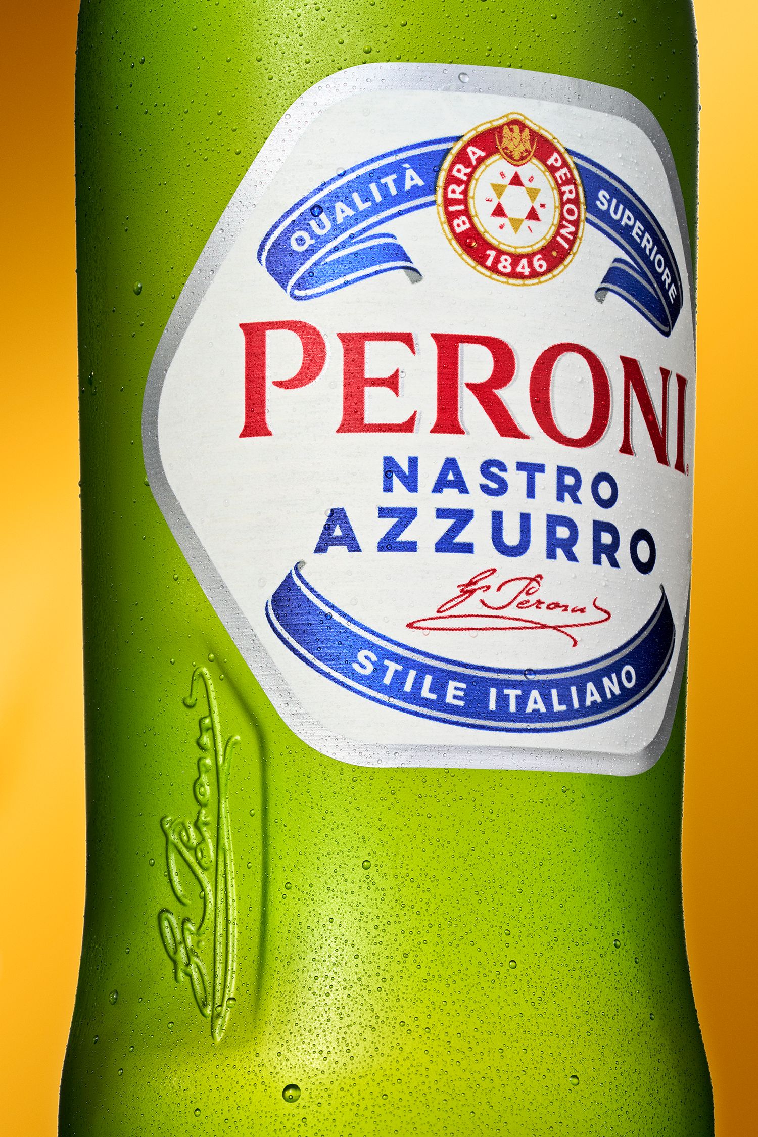Close-up detail shots of green Peroni beer bottles showing the brand's iconic blue and red logo labels.
