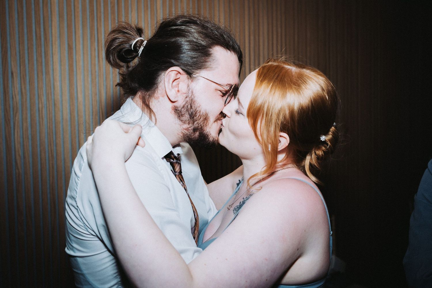 Romantic moment captured between a couple during their wedding celebration.