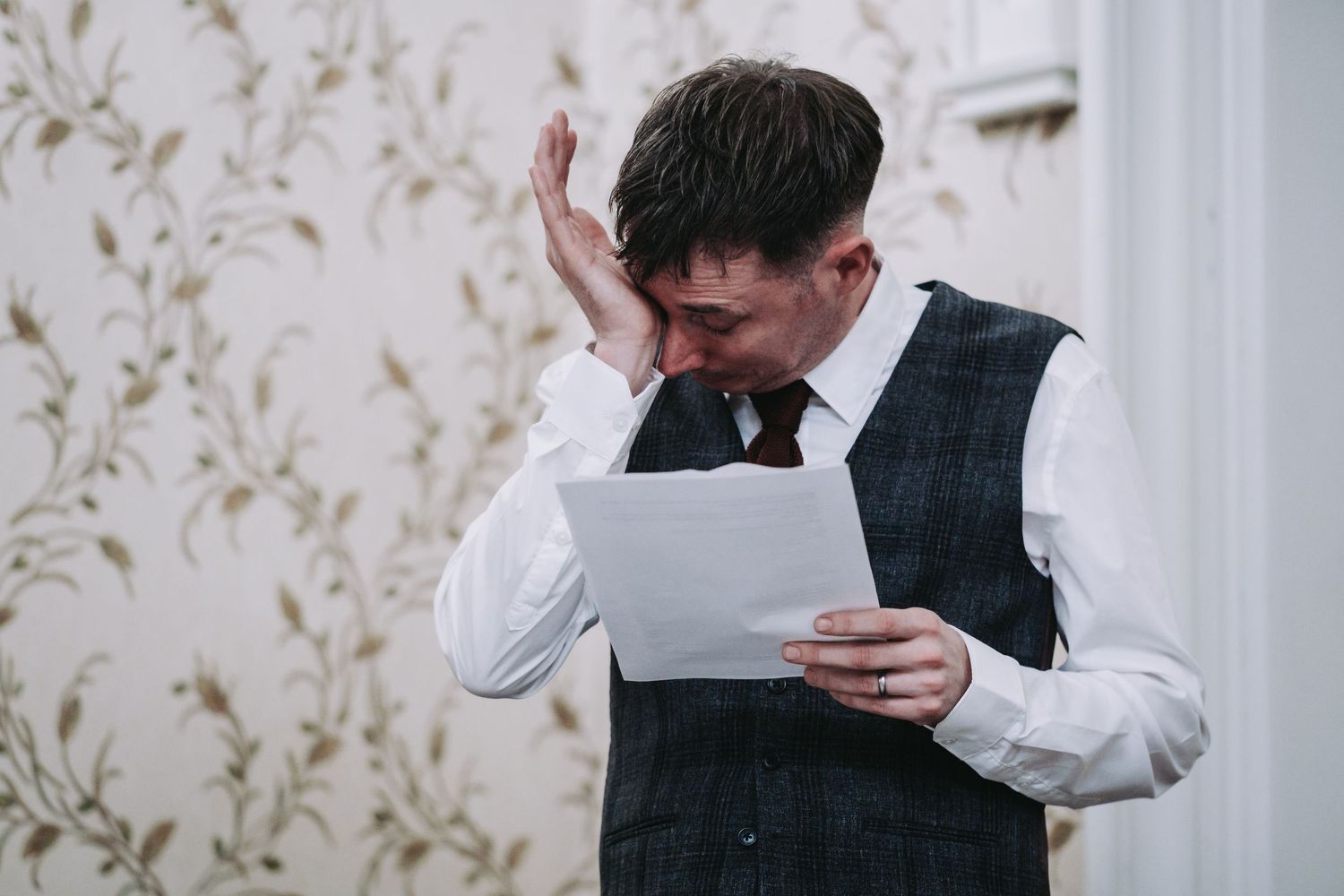 Wedding guests share emotional moments while reading speeches.