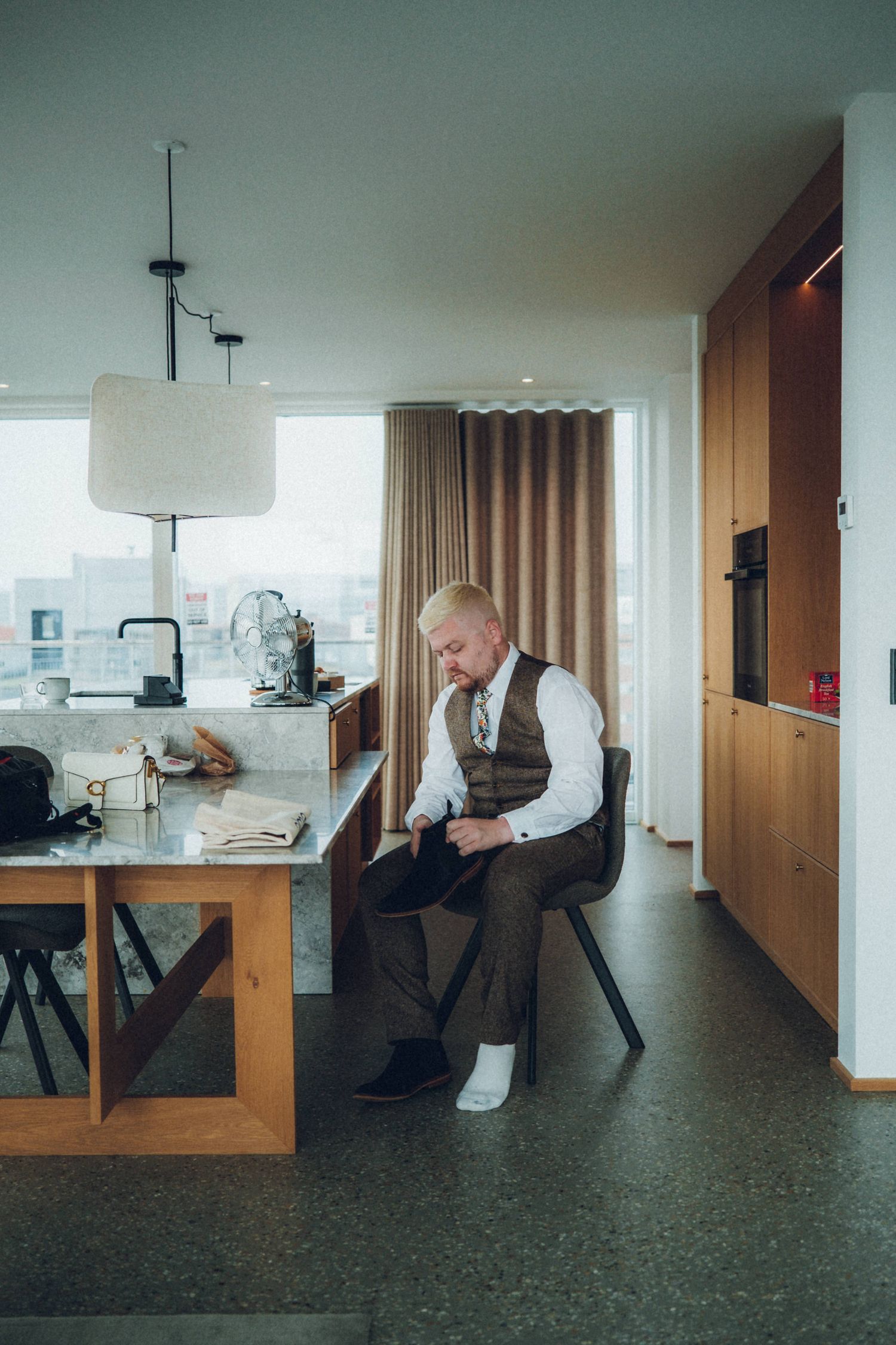 A sequence of images showing movement across a modern apartment interior with minimalist furniture.