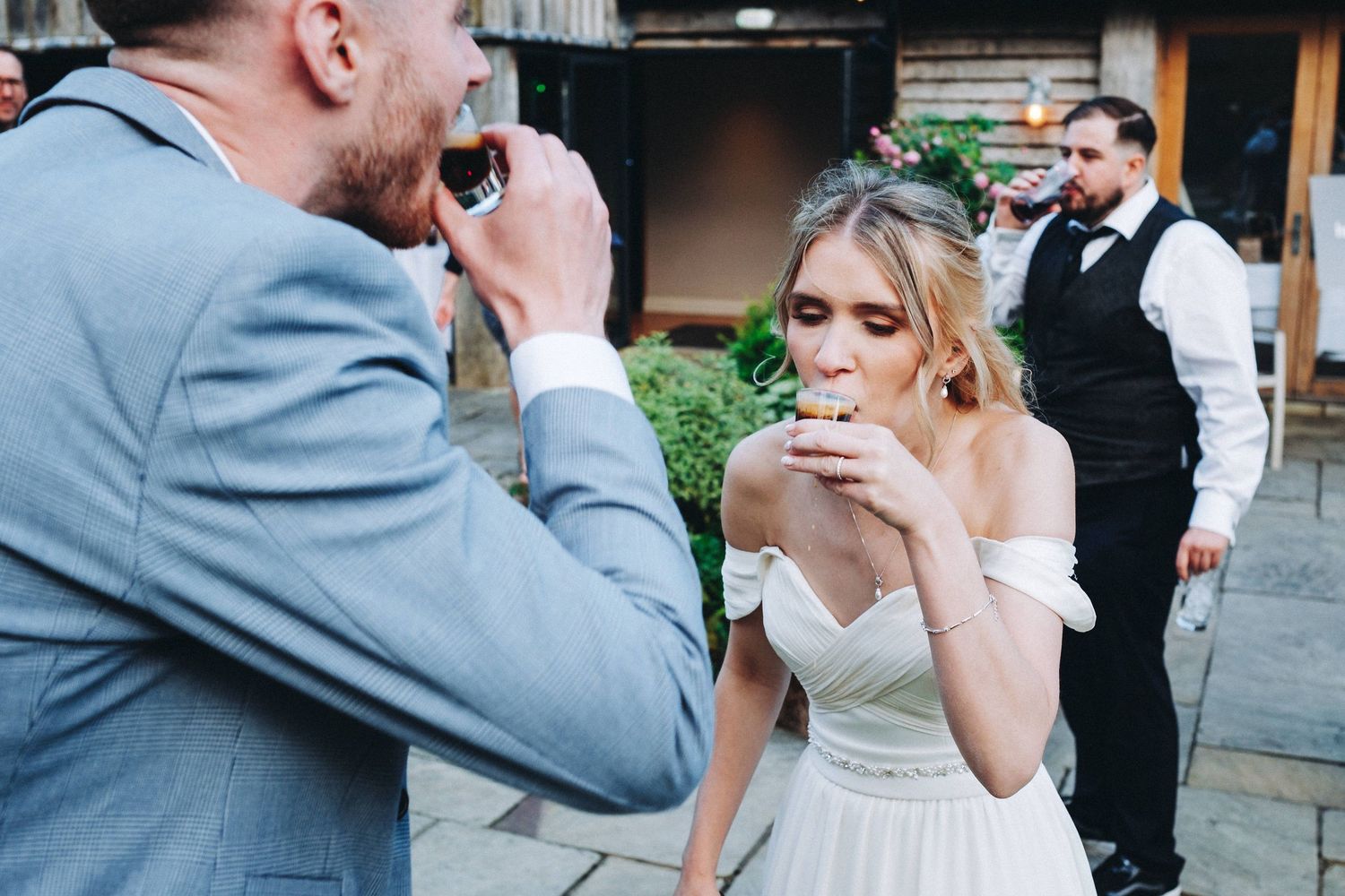 Wedding celebration candid moments captured during an outdoor reception.