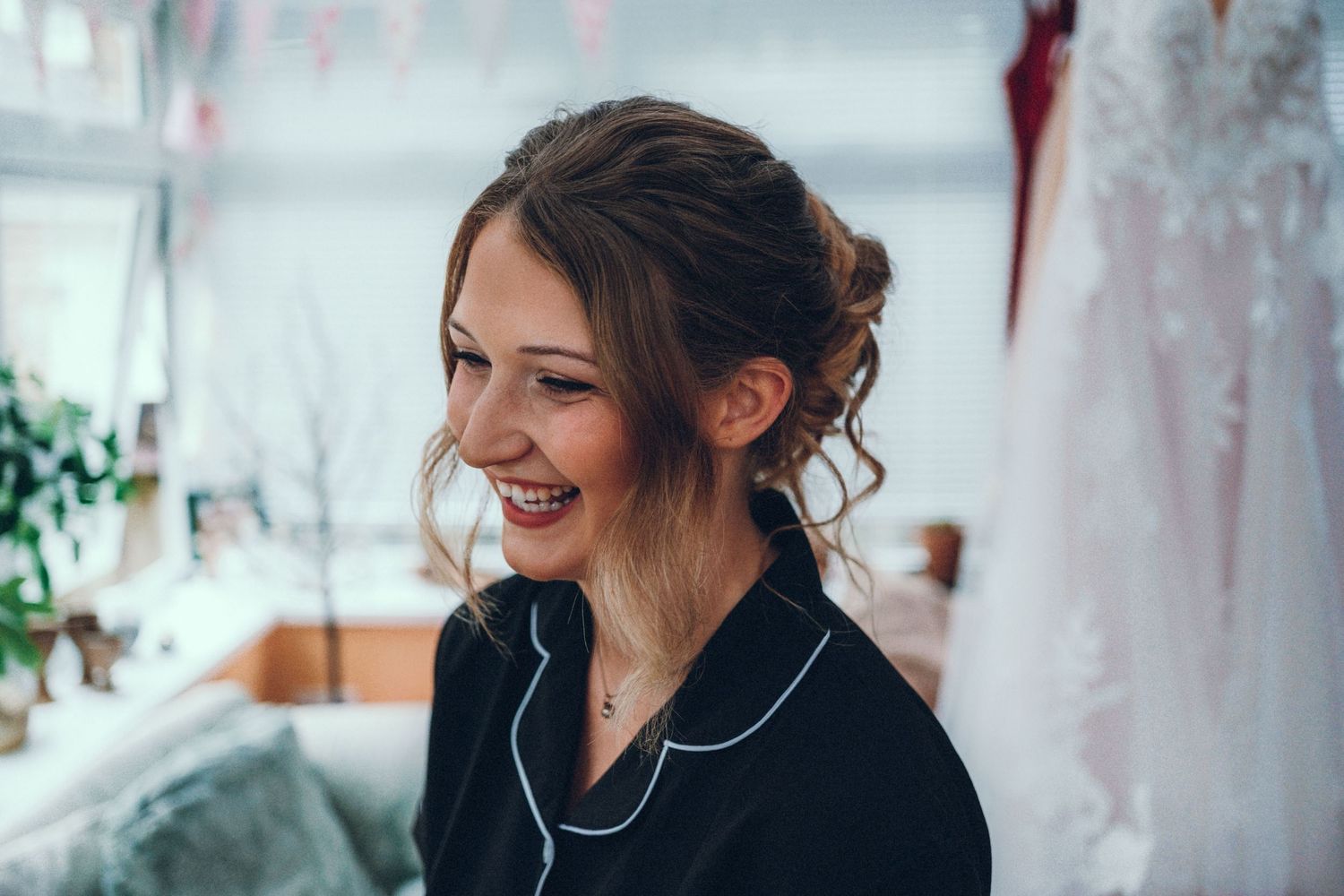 Candid moments captured during pre-event preparations in a bright room.