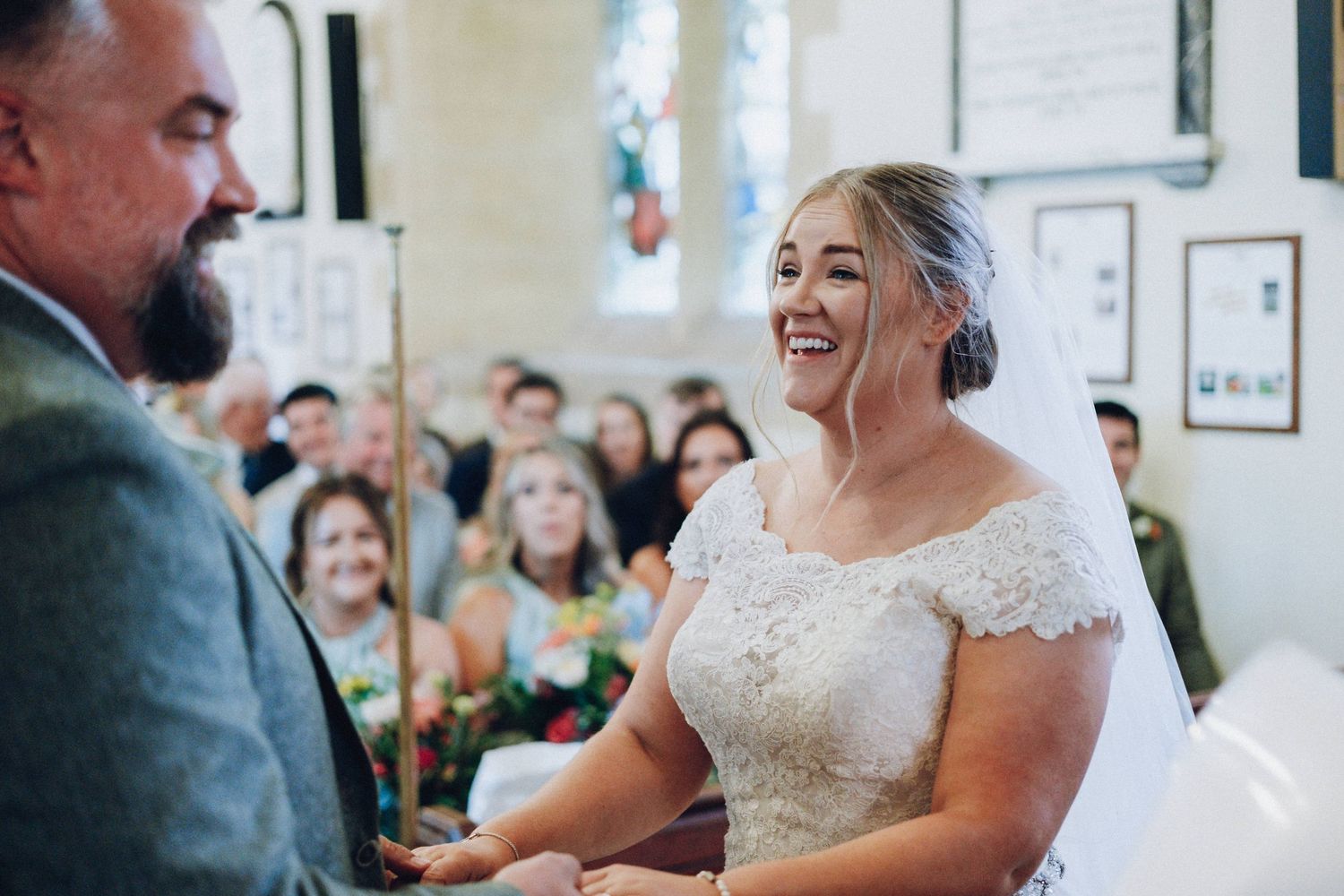 Candid moments from a wedding ceremony in a light-filled church setting.