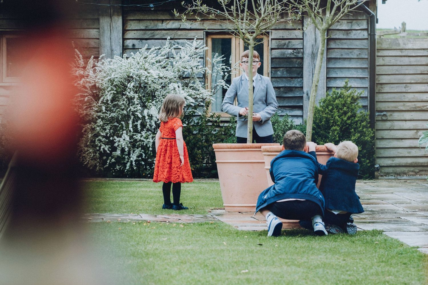 Outdoor wedding venue with garden setting and vintage architectural details.