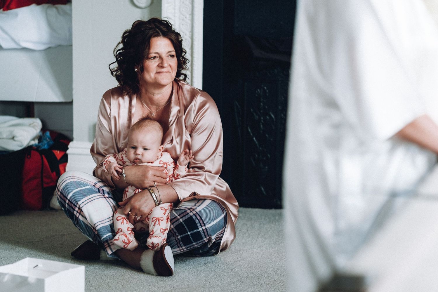 Intimate wedding preparation moments captured in a cozy indoor setting.