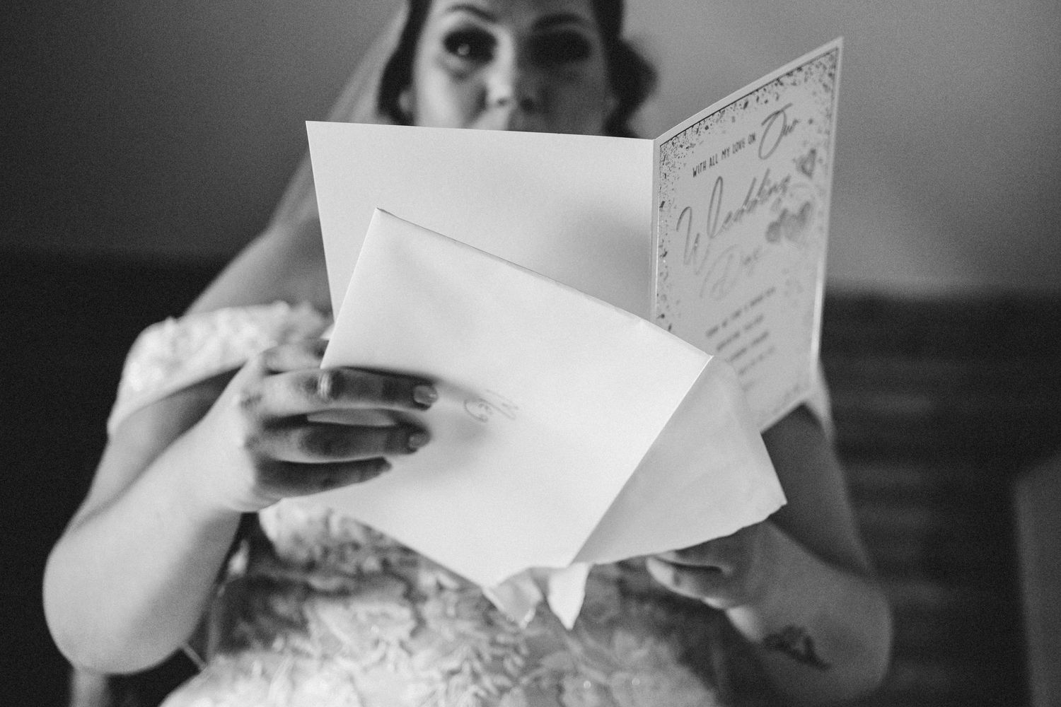 Black and white photo of wedding day preparation details and written notes.