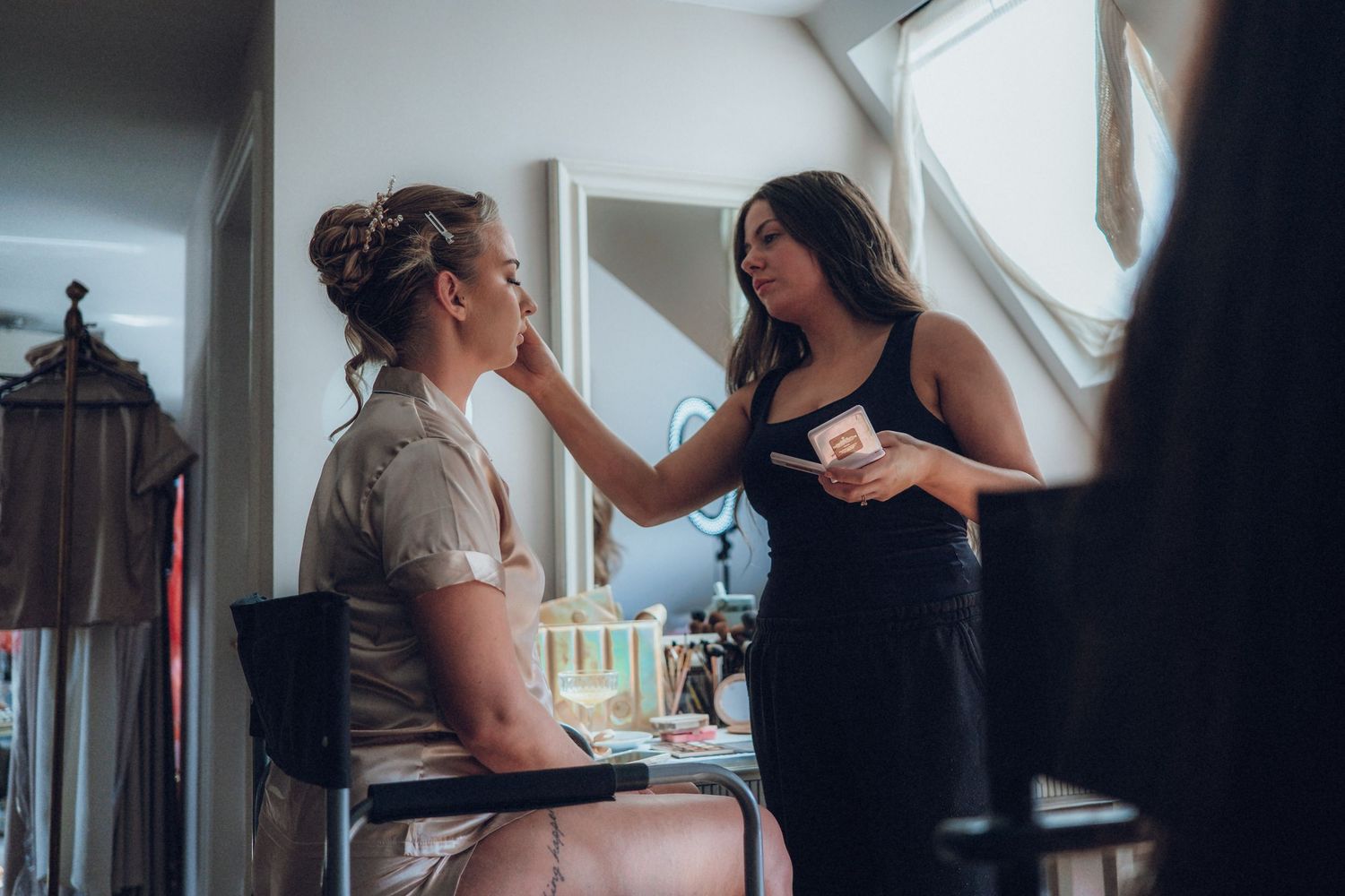 Getting ready moments before the wedding ceremony in natural window light.