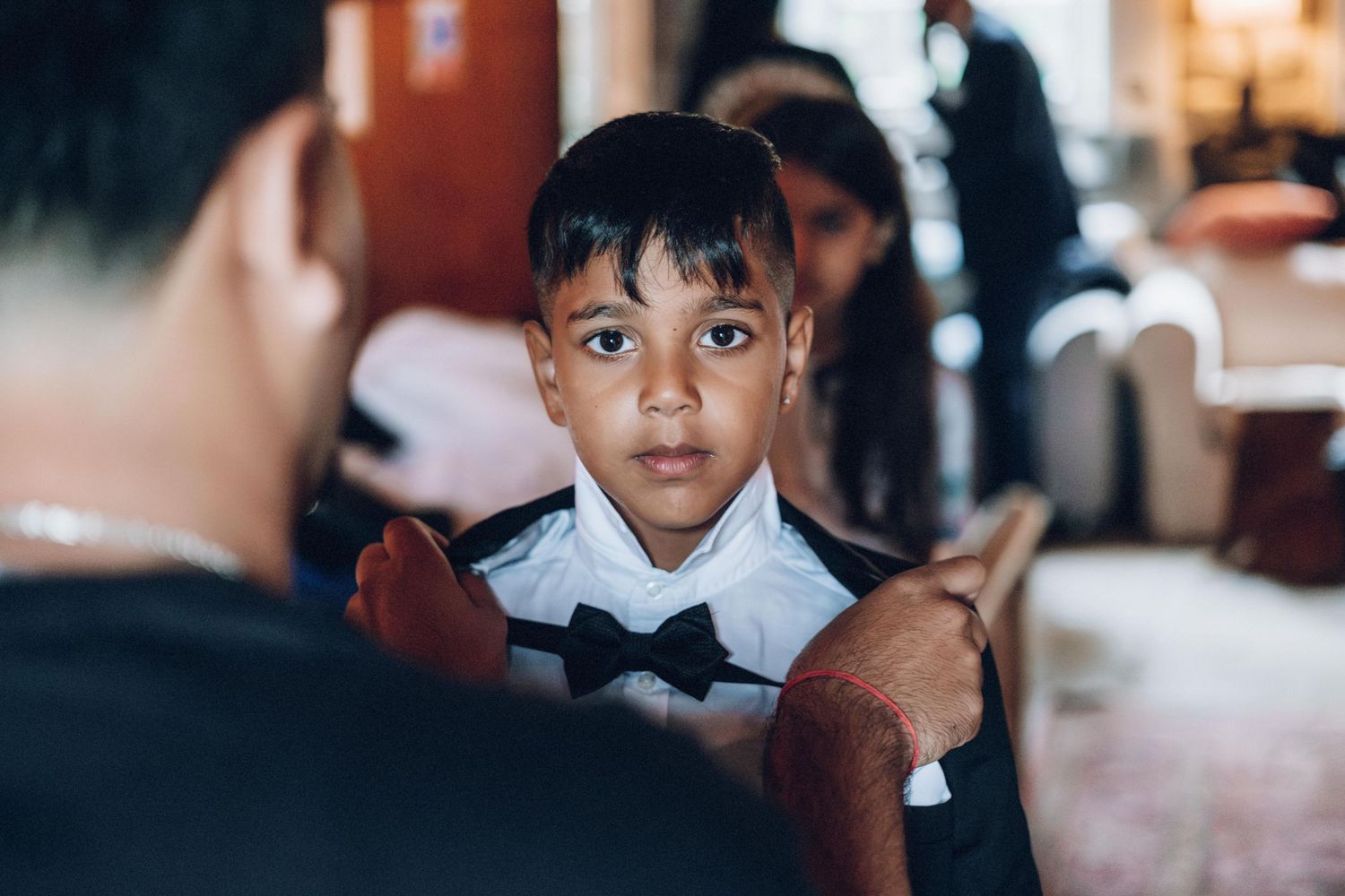 Children watching intently during a special event preparation.