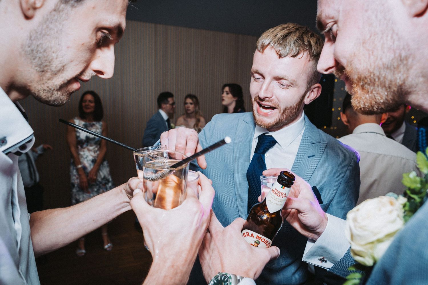 Candid moments of celebration and laughter during a wedding reception.