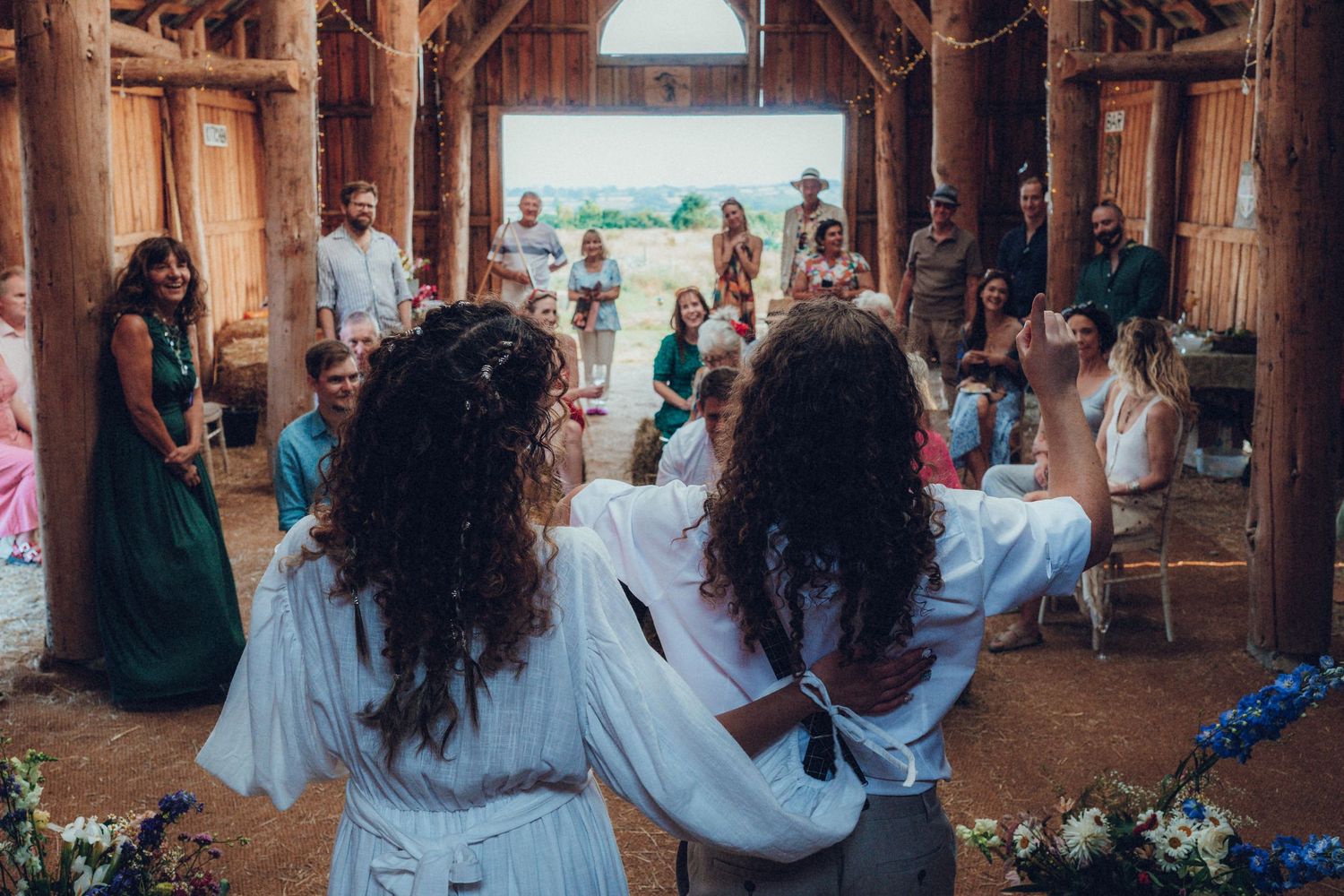 Inside view of a rustic wooden barn during a celebration event.