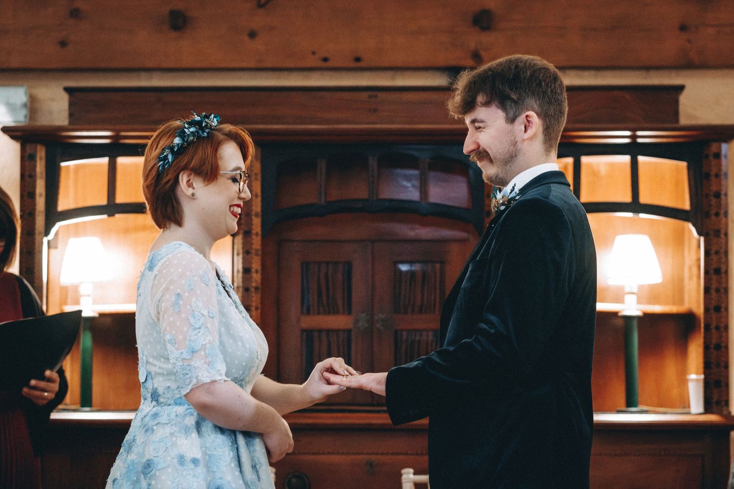 A couple holds hands during an intimate moment at their wedding ceremony.